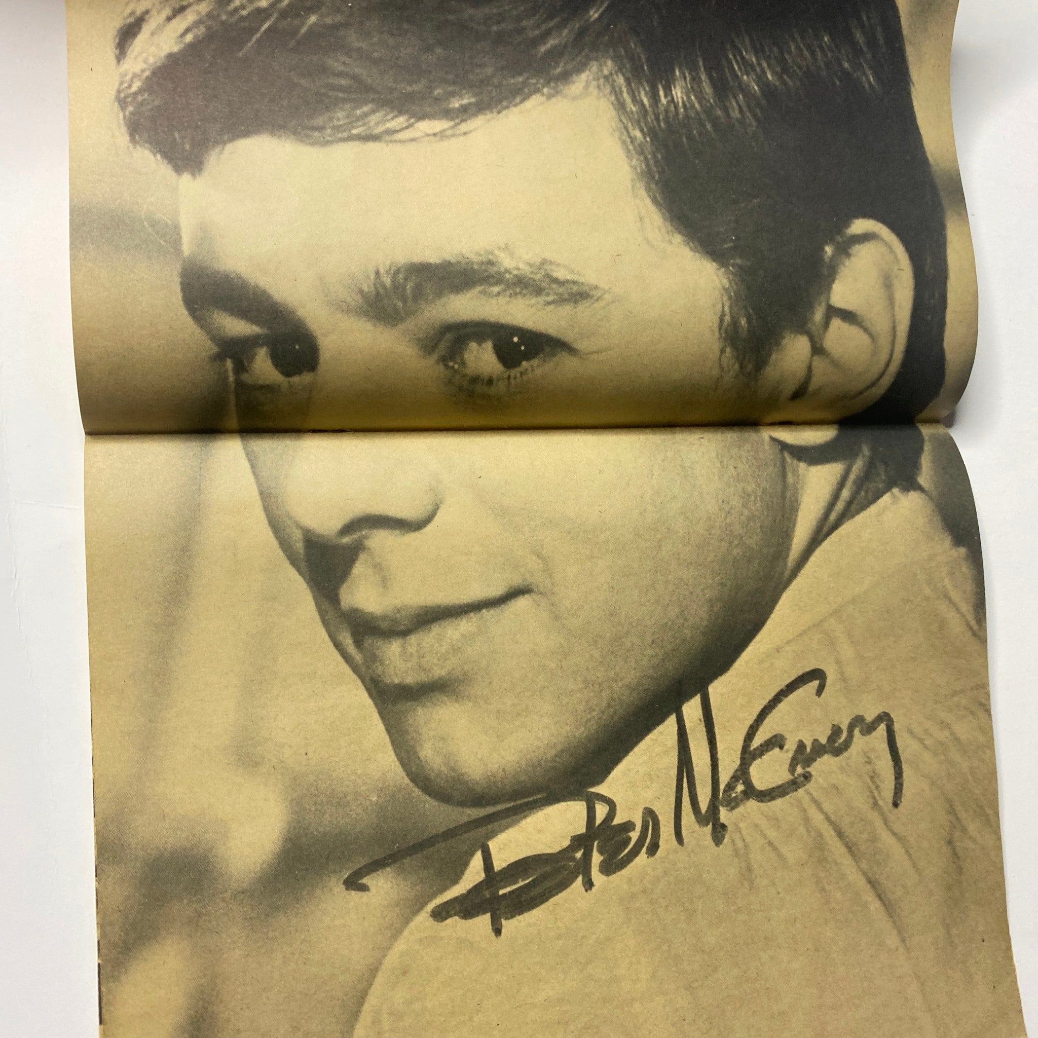 A vintage black and white portrait of Peter McEnery, signed, included in 16 Magazine January 1965 Vol 6 No. 8, representing the period's teen idol culture.