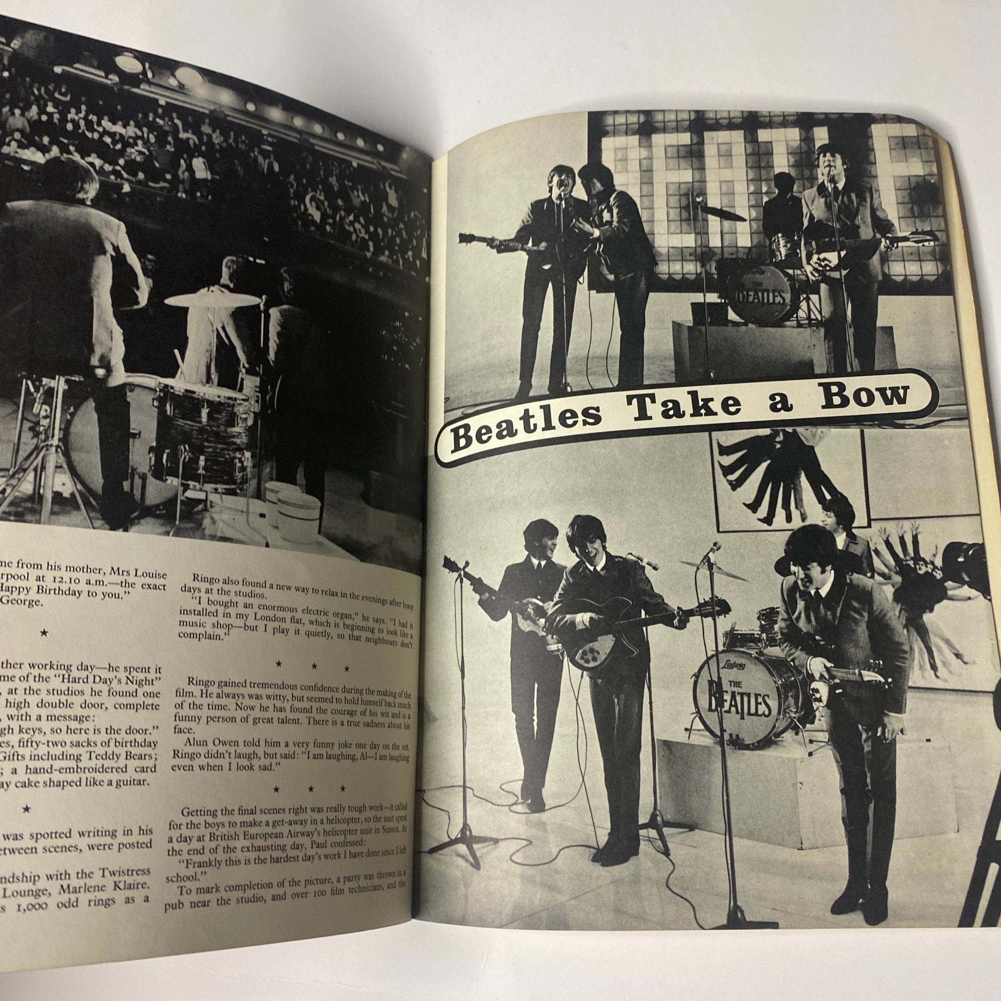 Page featuring performance images from the 1964 The Beatles Starring in A Hard Day's Night Official Souvenir Book, highlighting the band in action on stage.