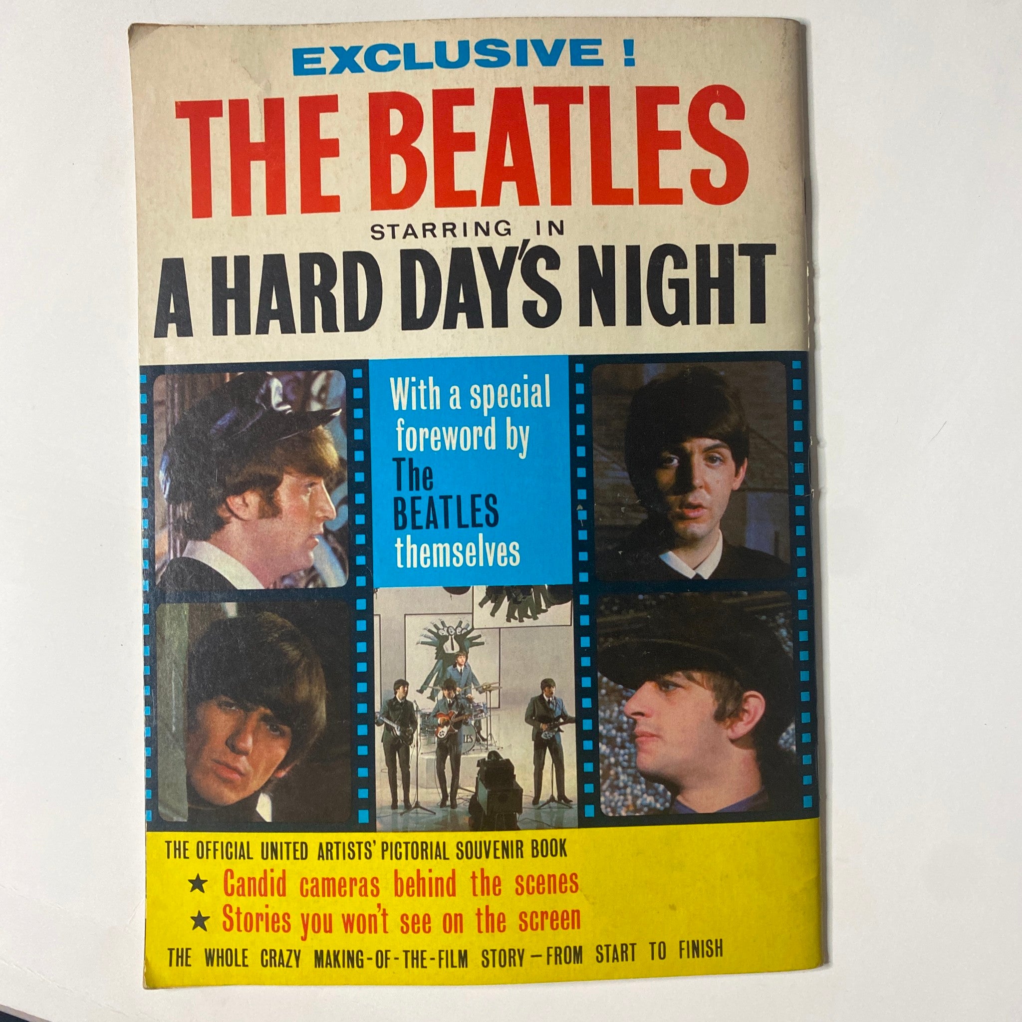 Official souvenir book titled 'The Beatles Starring in A Hard Day's Night' featuring images of the band and a description of behind-the-scenes stories. Published in 1964, it captures the essence of Beatlemania and is a collector's item.