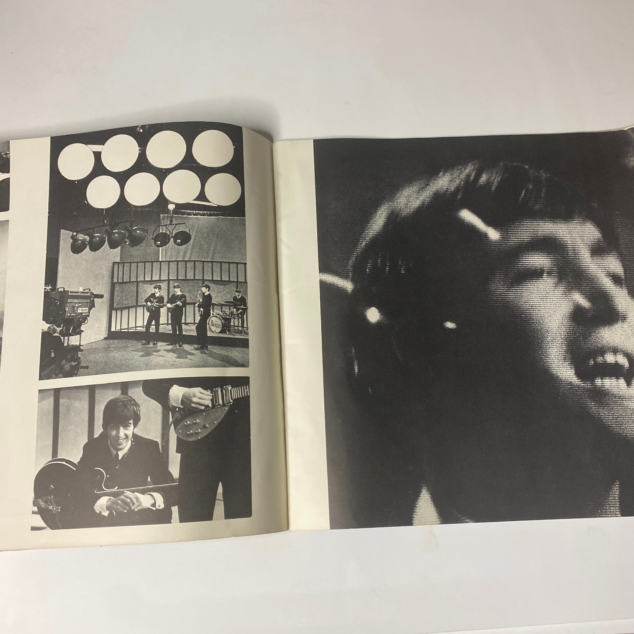 Inside spread from the 1964 Beatles (U.S.A.) Ltd. Limited Tour Program Book featuring black and white images of the Beatles during a performance.
