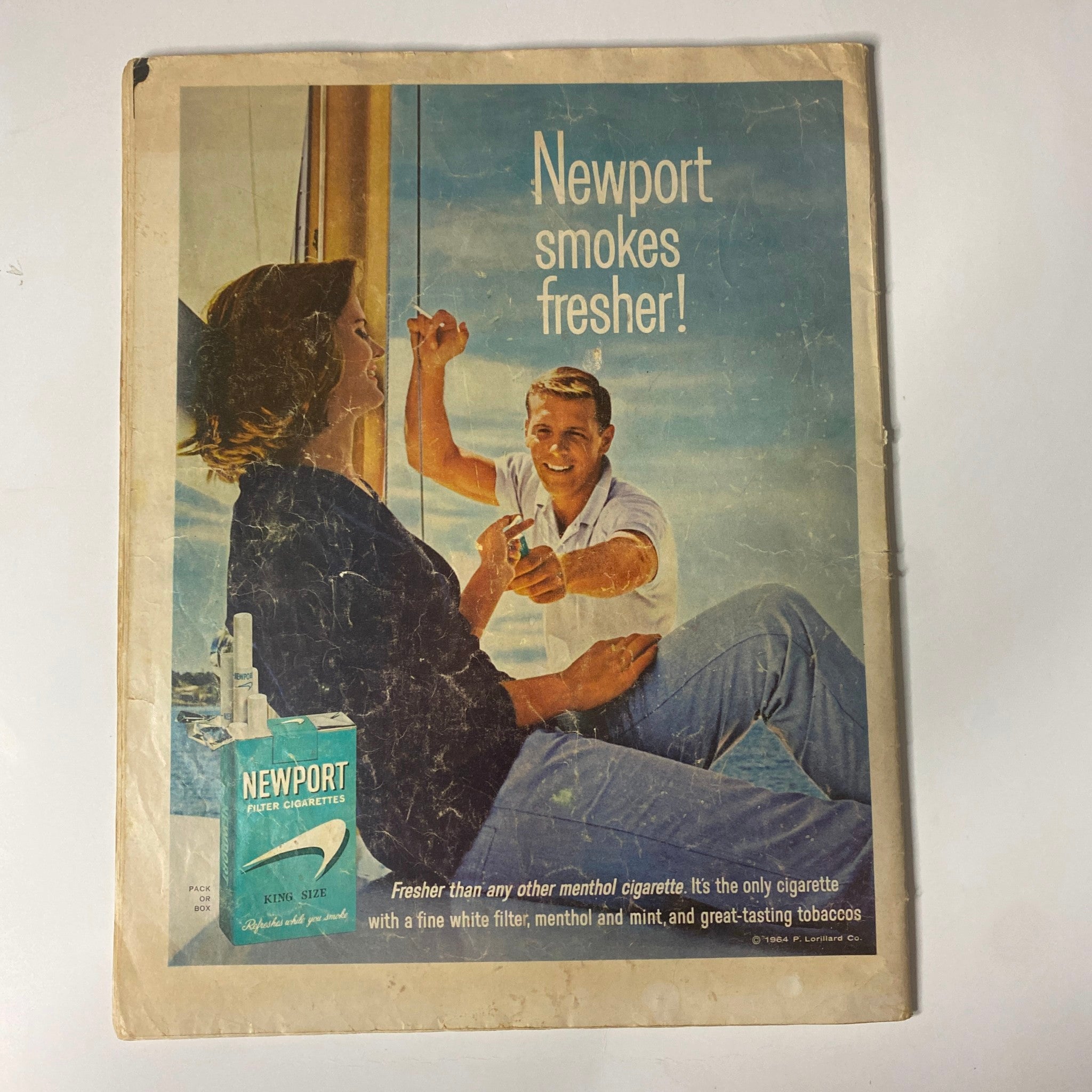 Vintage advertisement for Newport cigarettes featured on the back cover of The Saturday Evening Post March 21, 1964, illustrating 1960s marketing styles.