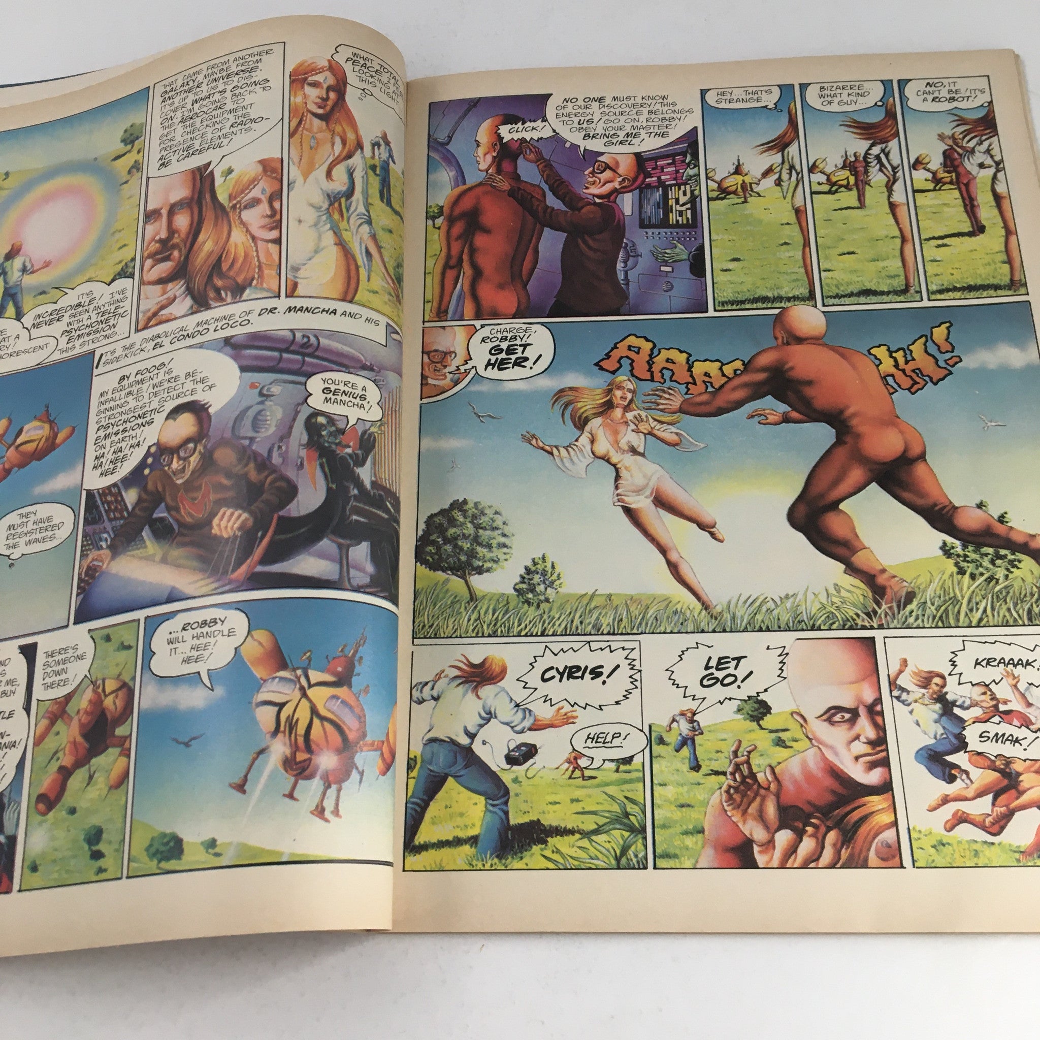 Pages from Heavy Metal Magazine December 1977 depicting colorful comic panels with action scenes, showcasing a blend of sci-fi and fantasy elements.