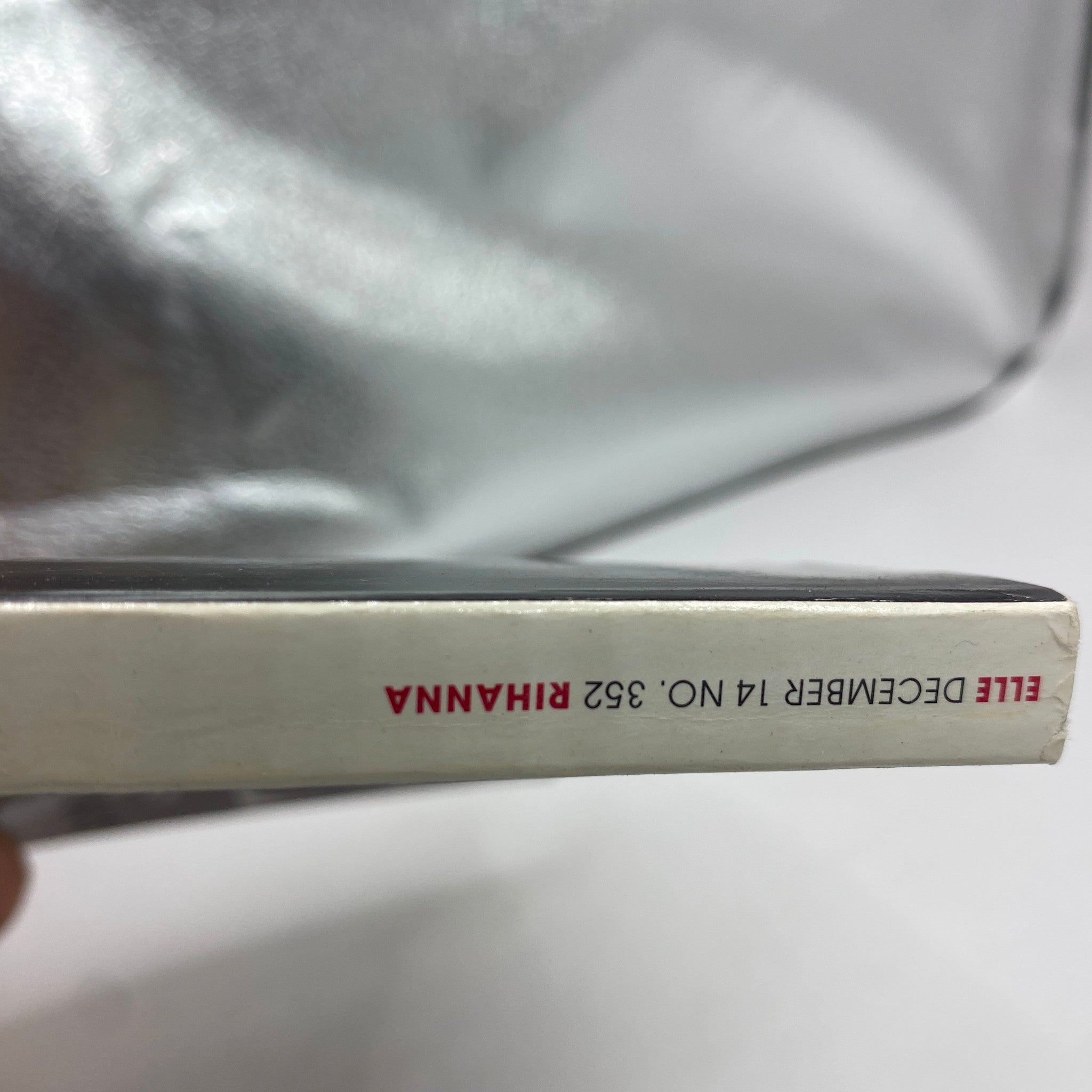 Spine of the Elle Magazine December 2014 featuring Rihanna, showcasing the issue number 352, highlighting its vintage status for collectors.