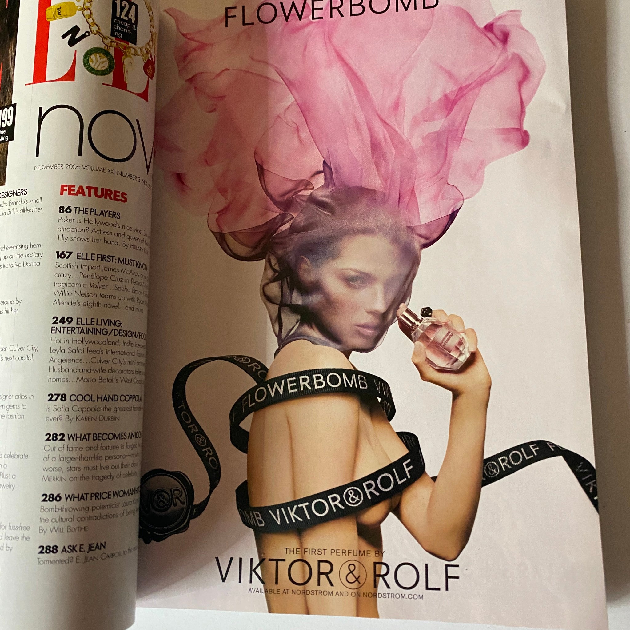 Page from Elle Magazine November 2006 displaying a beauty advertisement for Viktor & Rolf's Flowerbomb perfume, featuring striking visuals and design.