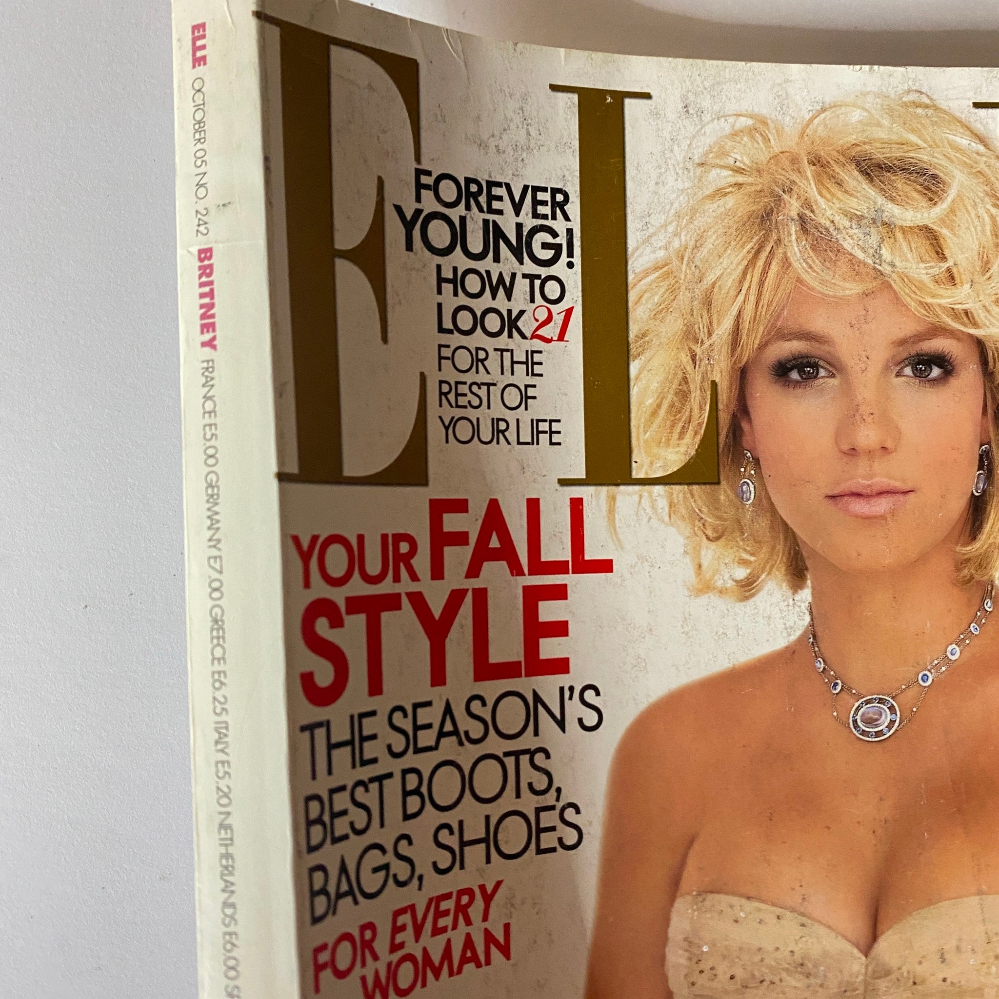 Elle Magazine October 2005 featuring Britney Spears on the cover, showcasing her blonde hair and fashionable attire with text highlighting fall style and beauty tips.