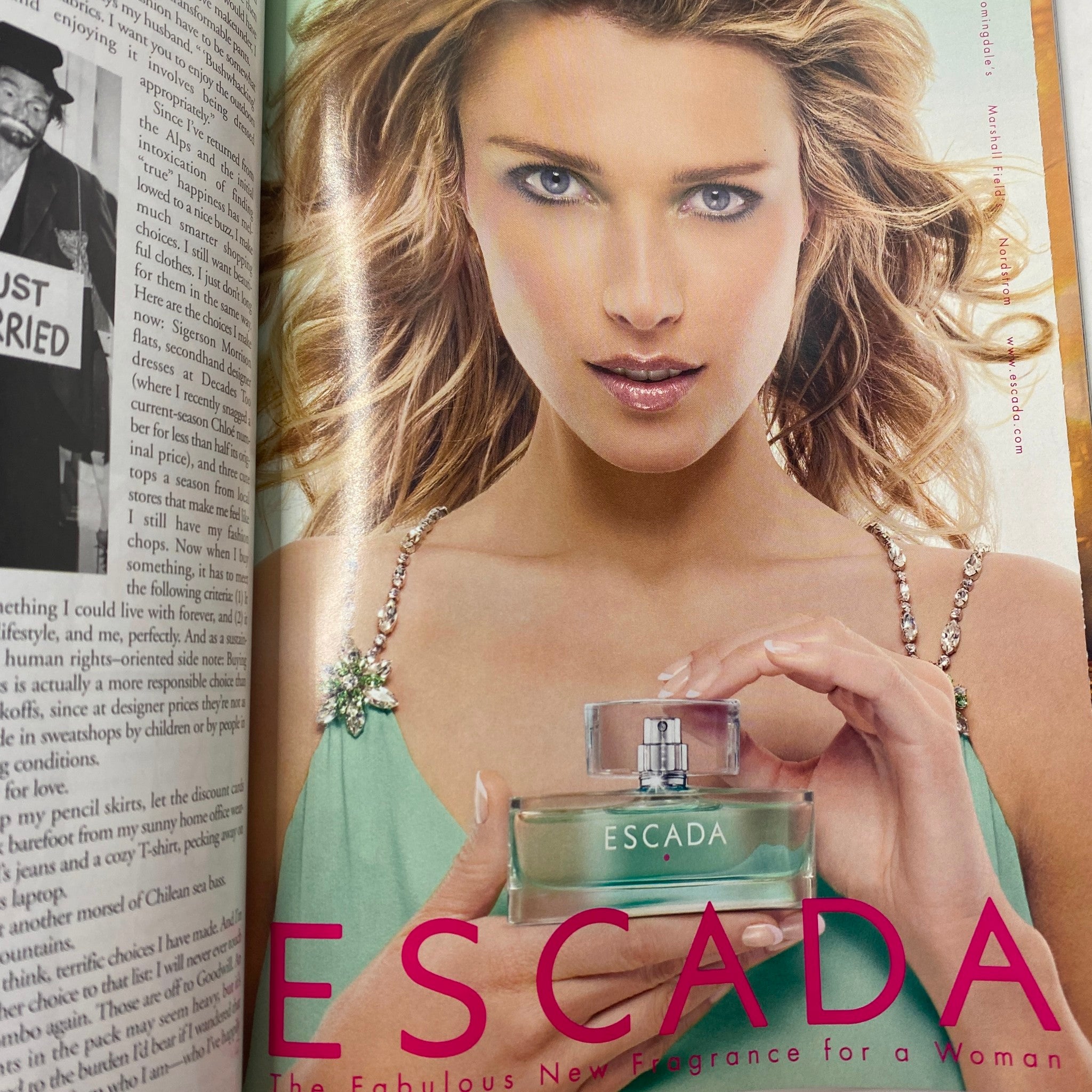 Advertisement for Escada fragrance featuring a model presenting the perfume, showcasing vibrant fashion and beauty trends from the mid-2000s as seen in Elle Magazine May 2006.