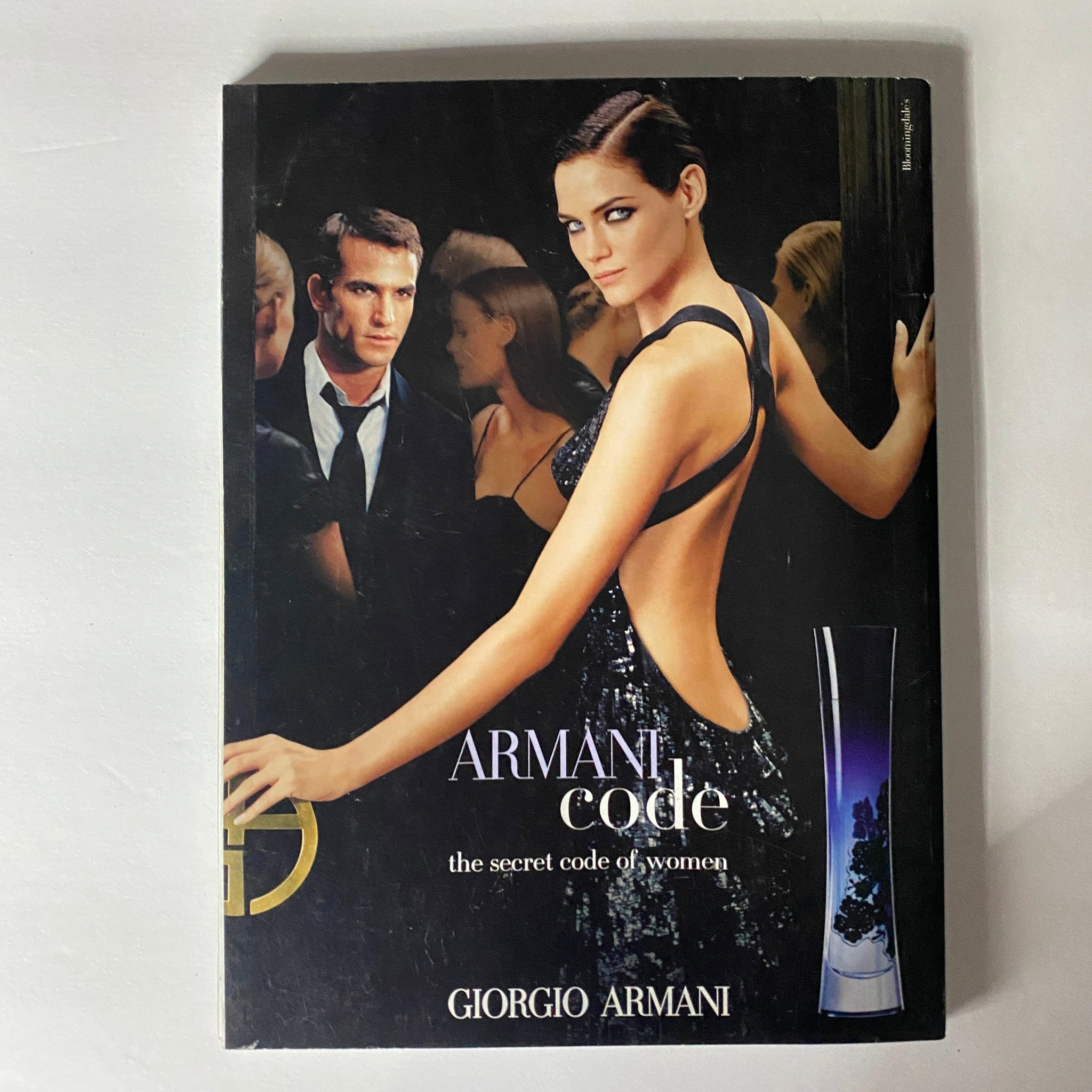 Promotional cover of Giorgio Armani Code fragrance, illustrating luxury and elegance, aligning with the themes of beauty and fashion in Elle Magazine May 2006.