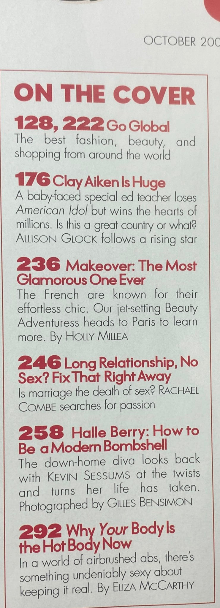 Elle Magazine October 2003 Halle Berry Cover featuring a list of articles including '128, 222 Go Global' and '176 Clay Aiken Is Huge', showcasing the magazine's diverse content.