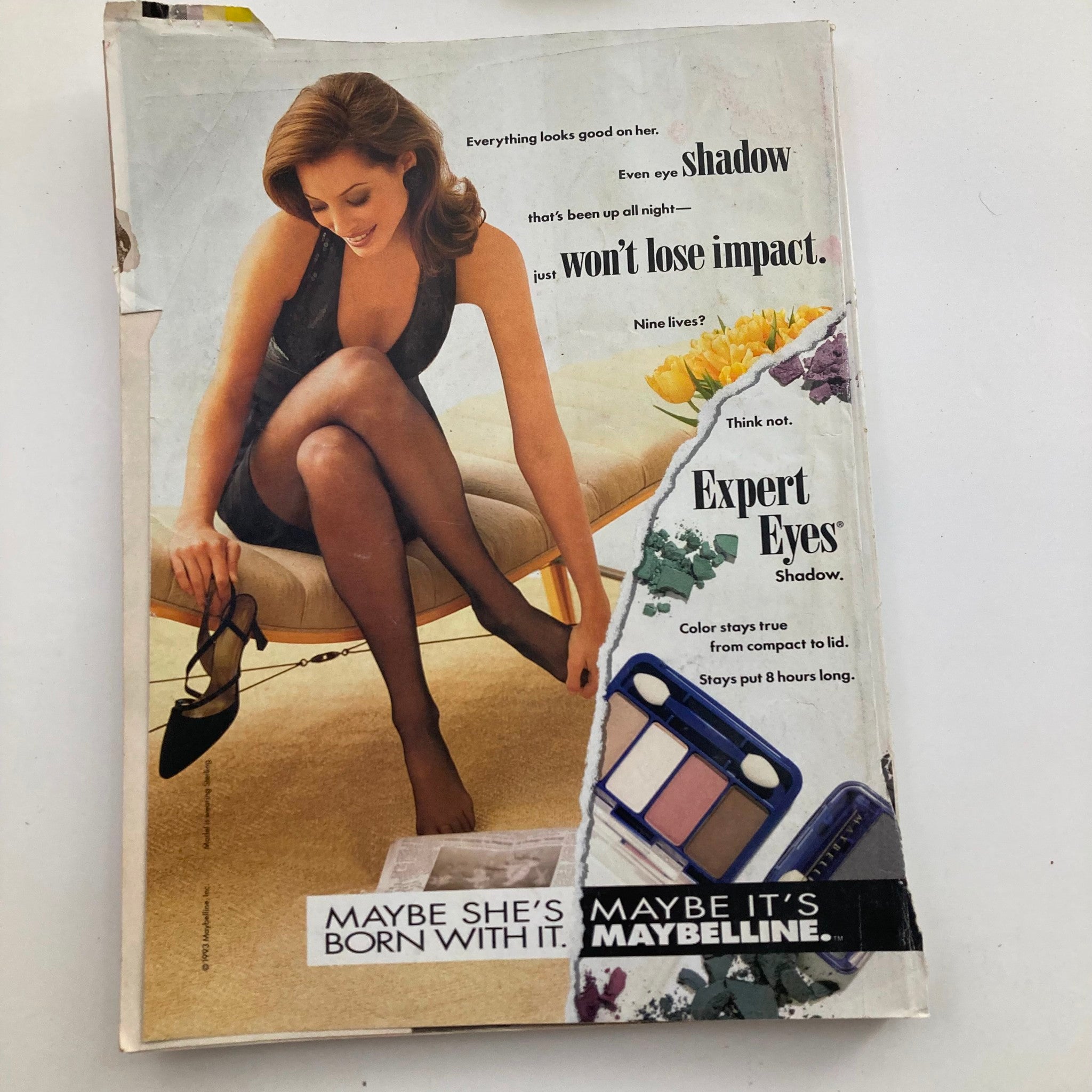 Glamour Magazine May 1993 back cover advertisement showcasing a model promoting Maybelline's Expert Eyes shadow with stylish fashion.
