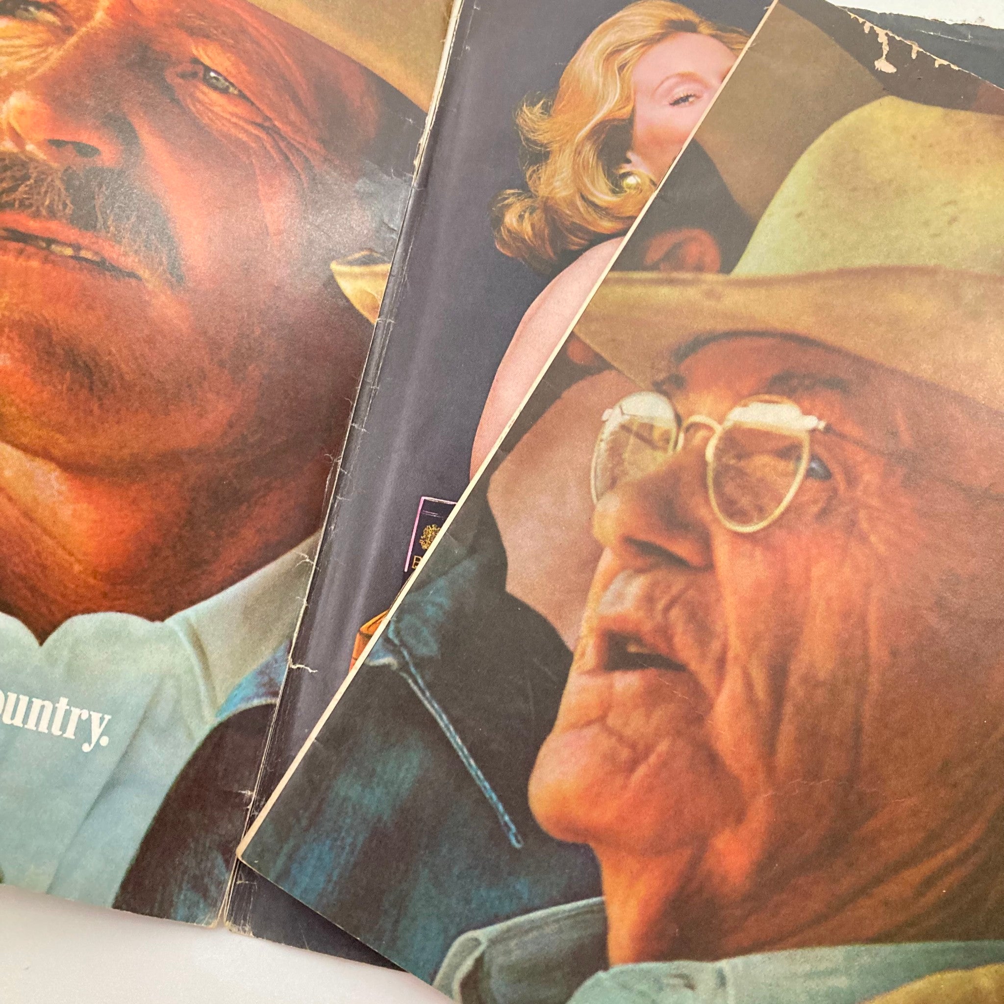 Detailed view of vintage magazine pages from VTG Argosy Magazine Man's World November 1974 showing portraits. This issue features iconic imagery and storytelling, embodying the spirit of the 1970s.