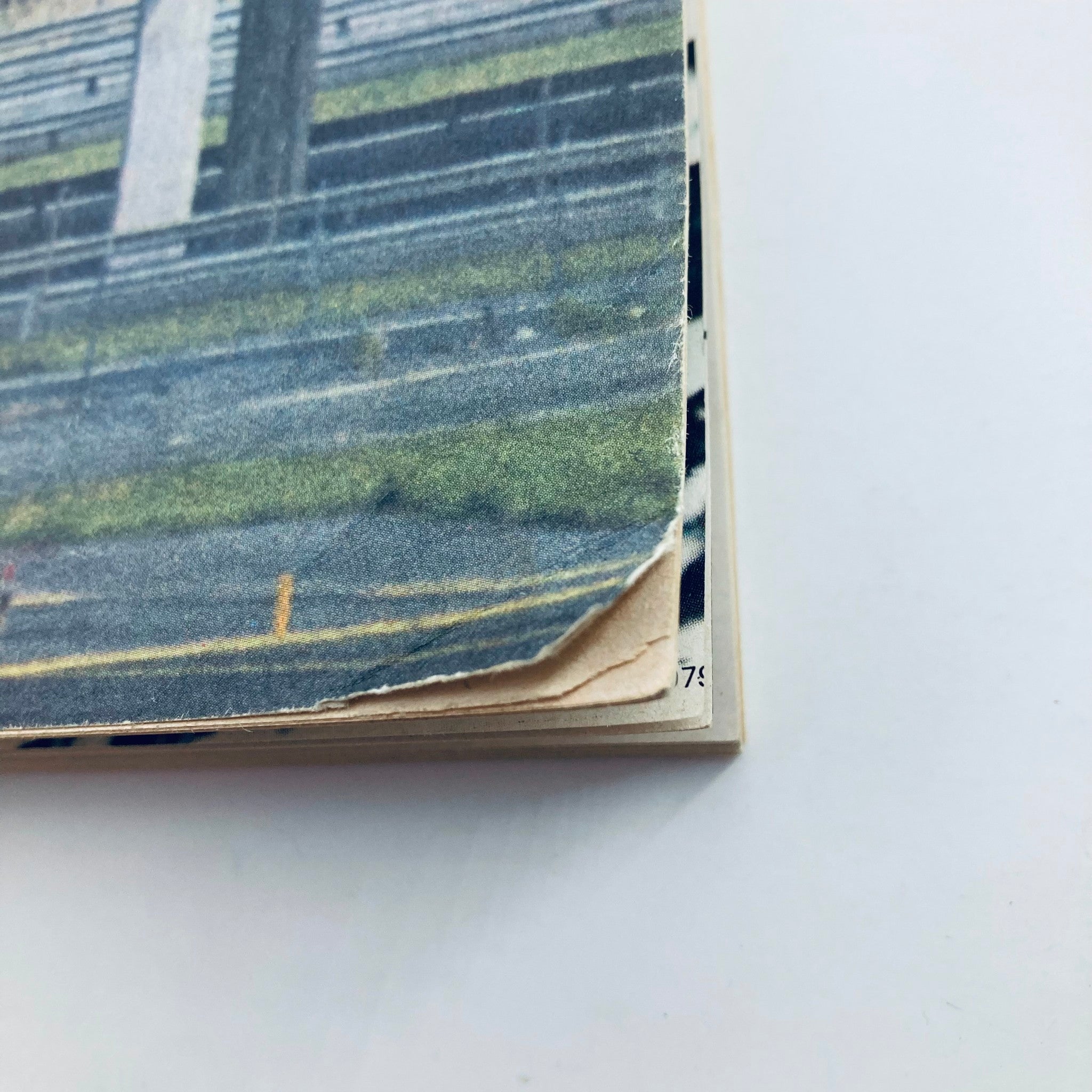 Close-up of the spine of the VTG Fortune Magazine July 1971, showing signs of wear, indicating its vintage nature and authenticity.