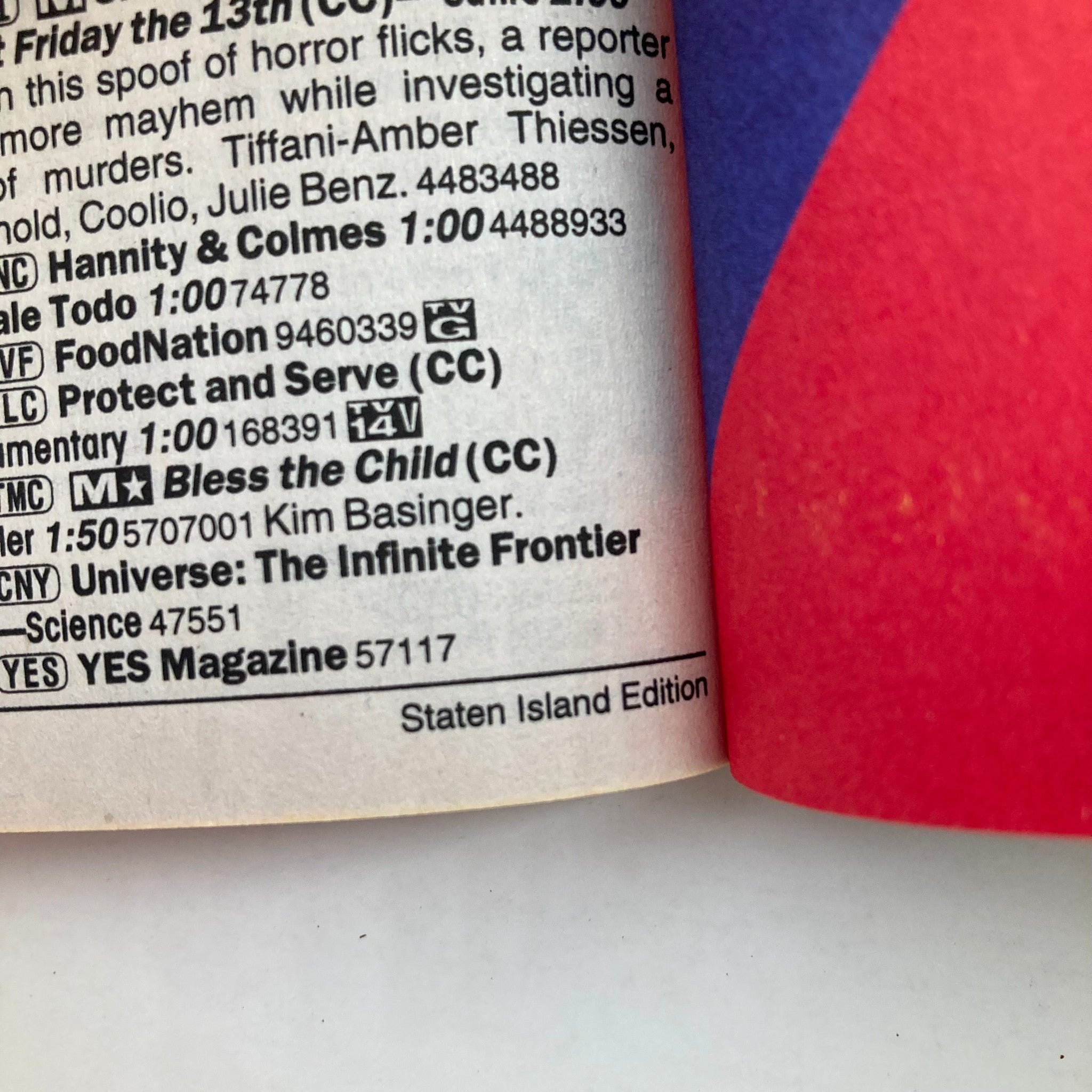 Close-up of the back cover of TV Guide Magazine August 17 2002 Staten Island Edition, listing contents and programming details related to horror films and Elvis Presley.
