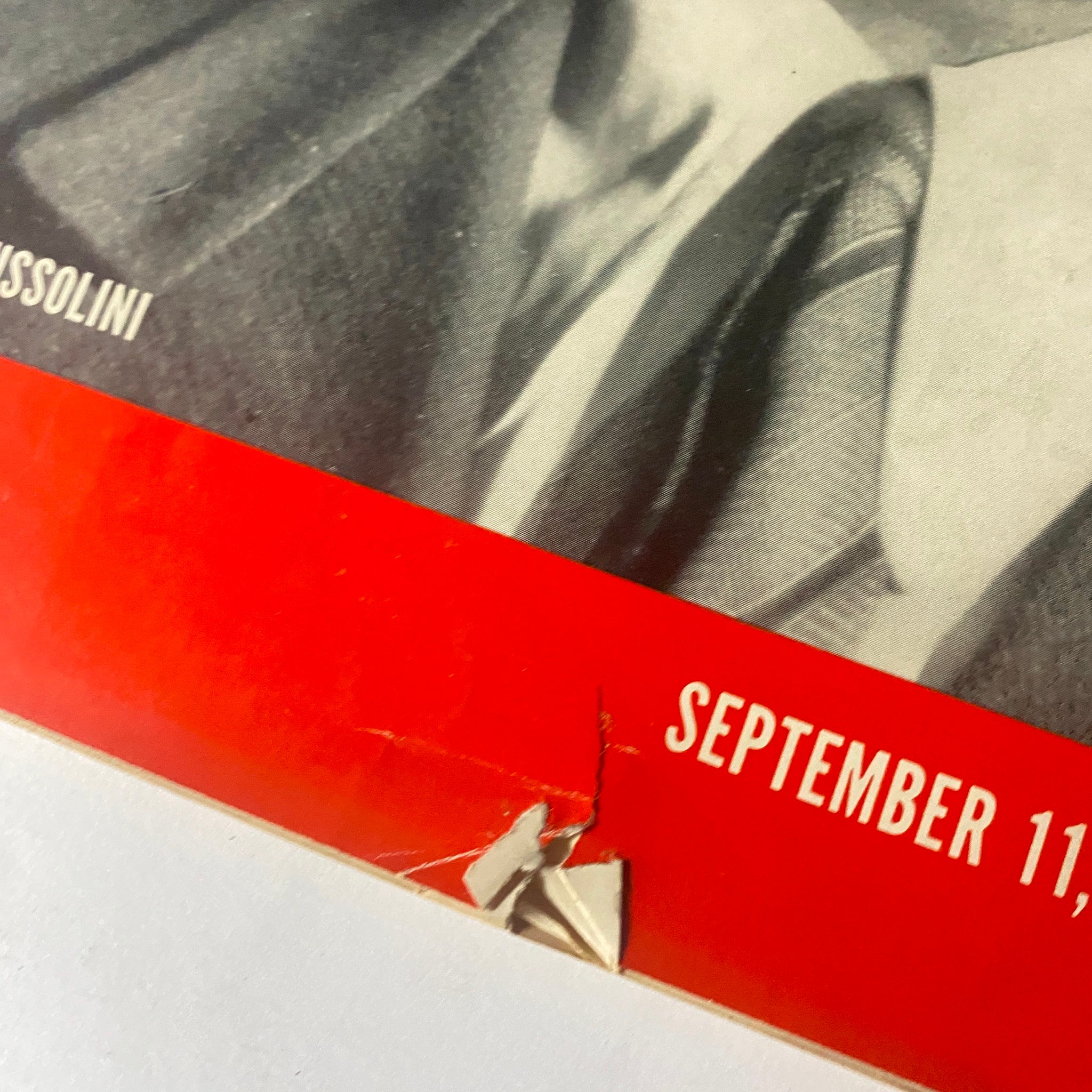 Close-up view of the corner of Life Magazine September 11, 1939 cover featuring Benito Mussolini, highlighting minor damage.