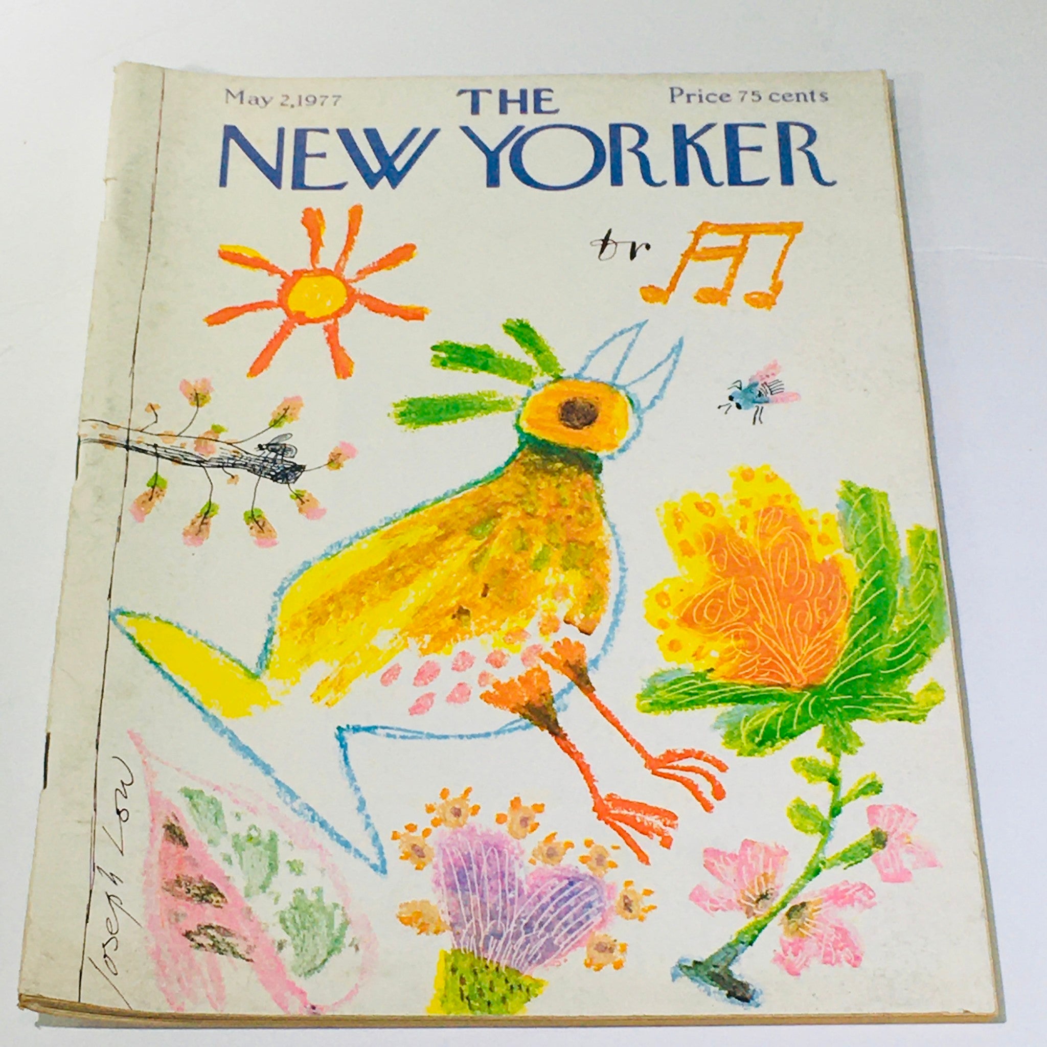 The New Yorker: May 2 1977 magazine cover featuring a colorful illustration by Joseph Low, showcasing a vibrant bird and flowers, capturing the artistic essence of vintage journalism.