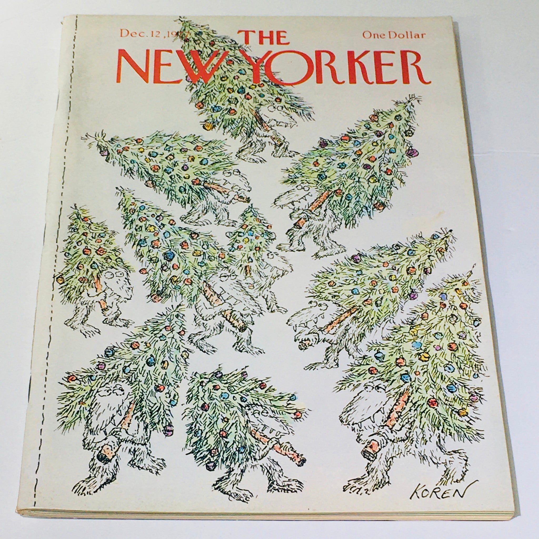 Cover of The New Yorker dated December 12, 1977, featuring whimsical illustrations of Christmas trees and creatures by Ed Koren, showcasing a unique vintage design and charm.