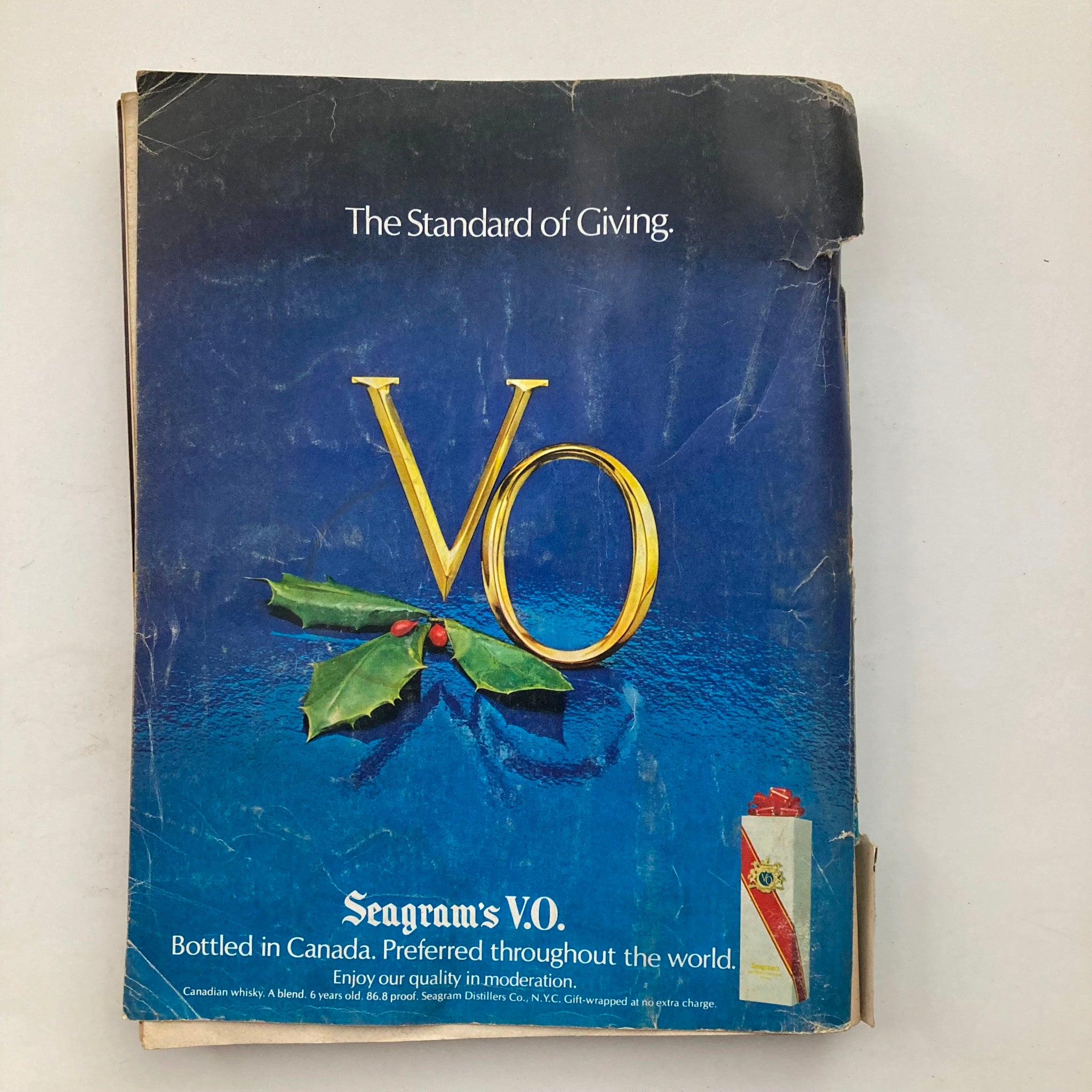 Back cover of VTG Playboy Magazine December 1978, advertising Seagram's V.O., with a festive design and wear visible, reflecting its vintage status.
