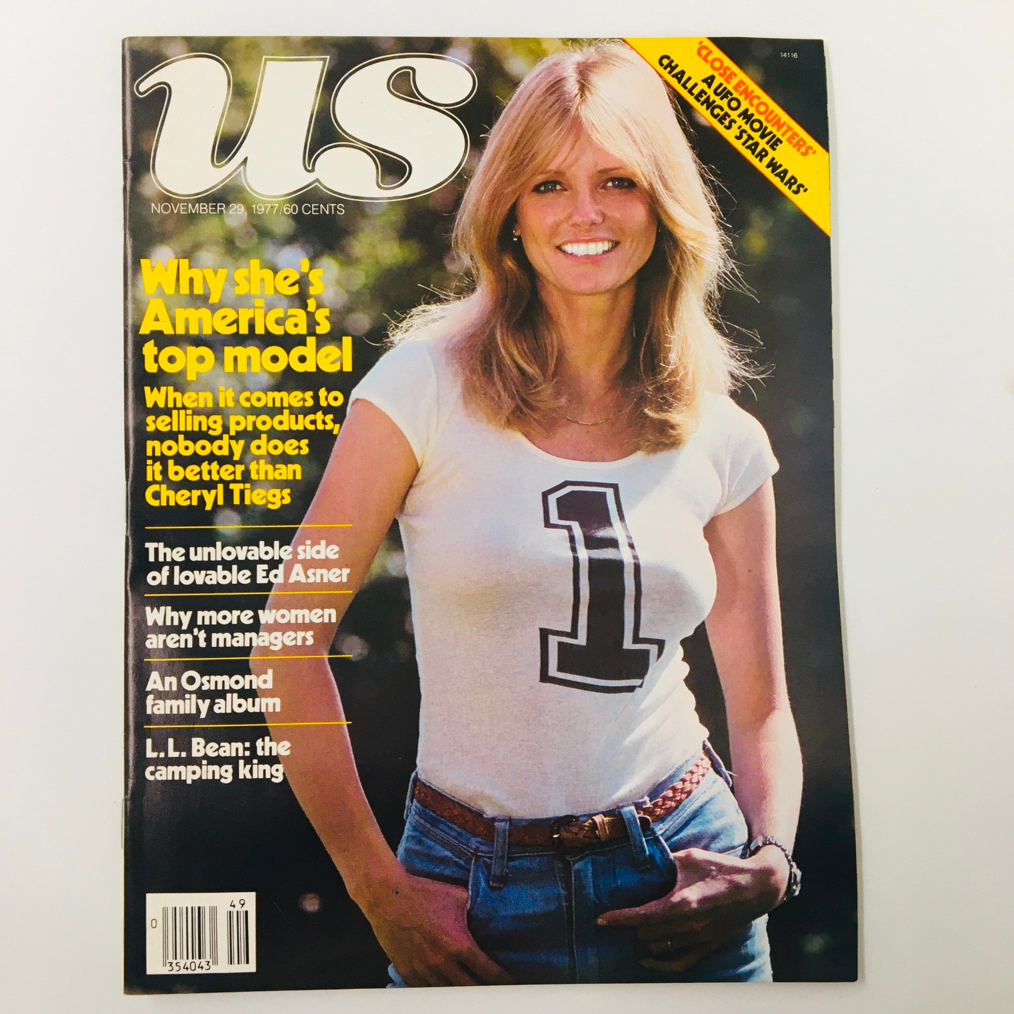 VTG US Magazine November 29 1977 cover featuring America's Top Model Cheryl Tiegs in a white shirt with number 1, showcasing her as a popular model of the era.