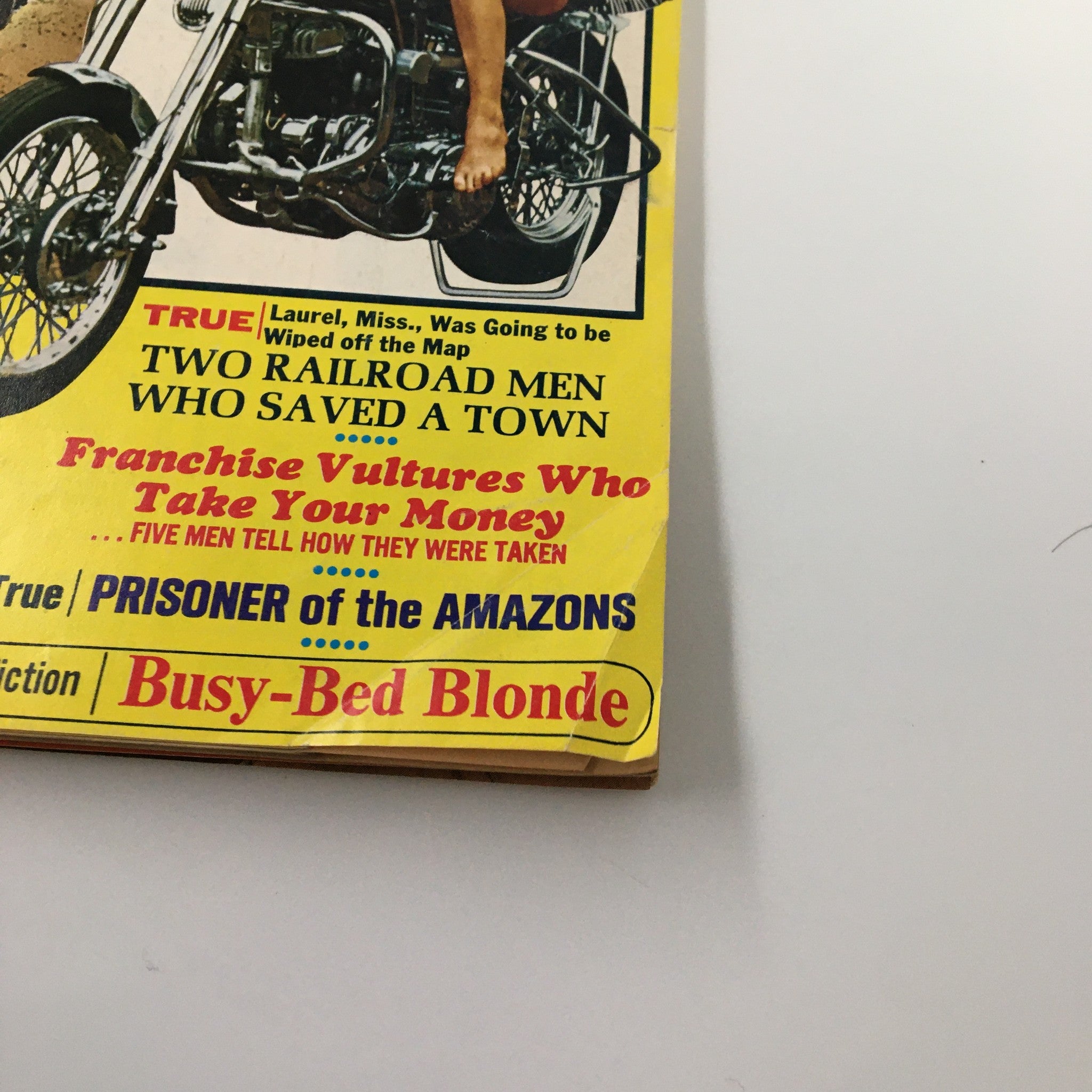 Detail view of the side cover text from VTG Male Magazine May 1972 showcasing articles like 'Two Railroad Men Who Saved A Town' and 'Franchise Vultures Who Take Your Money'.
