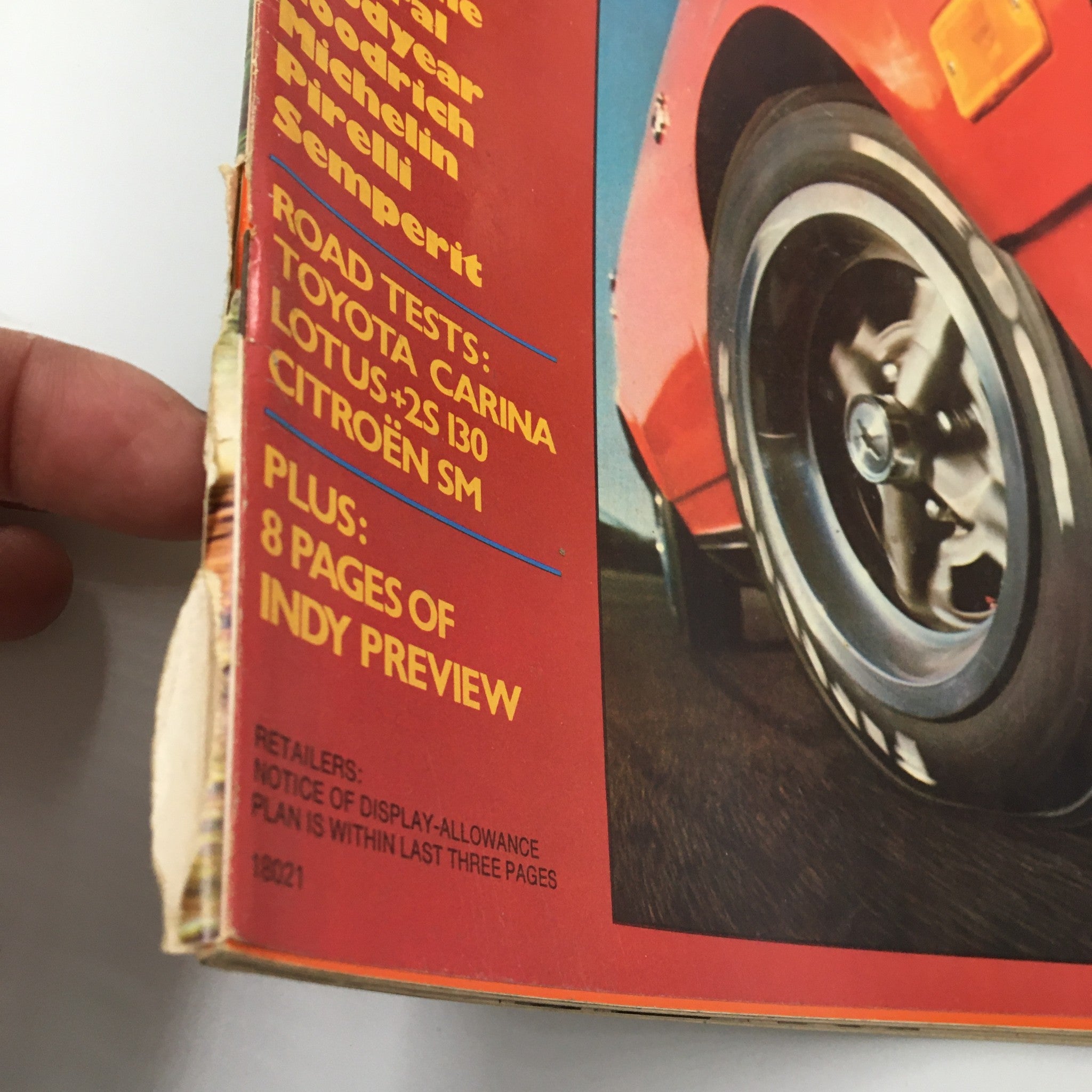 Close-up view of the spine of VTG Car and Driver Magazine June 1972 highlighting wear on the binding and road tests for Toyota Carina and Lotus +2s 130.