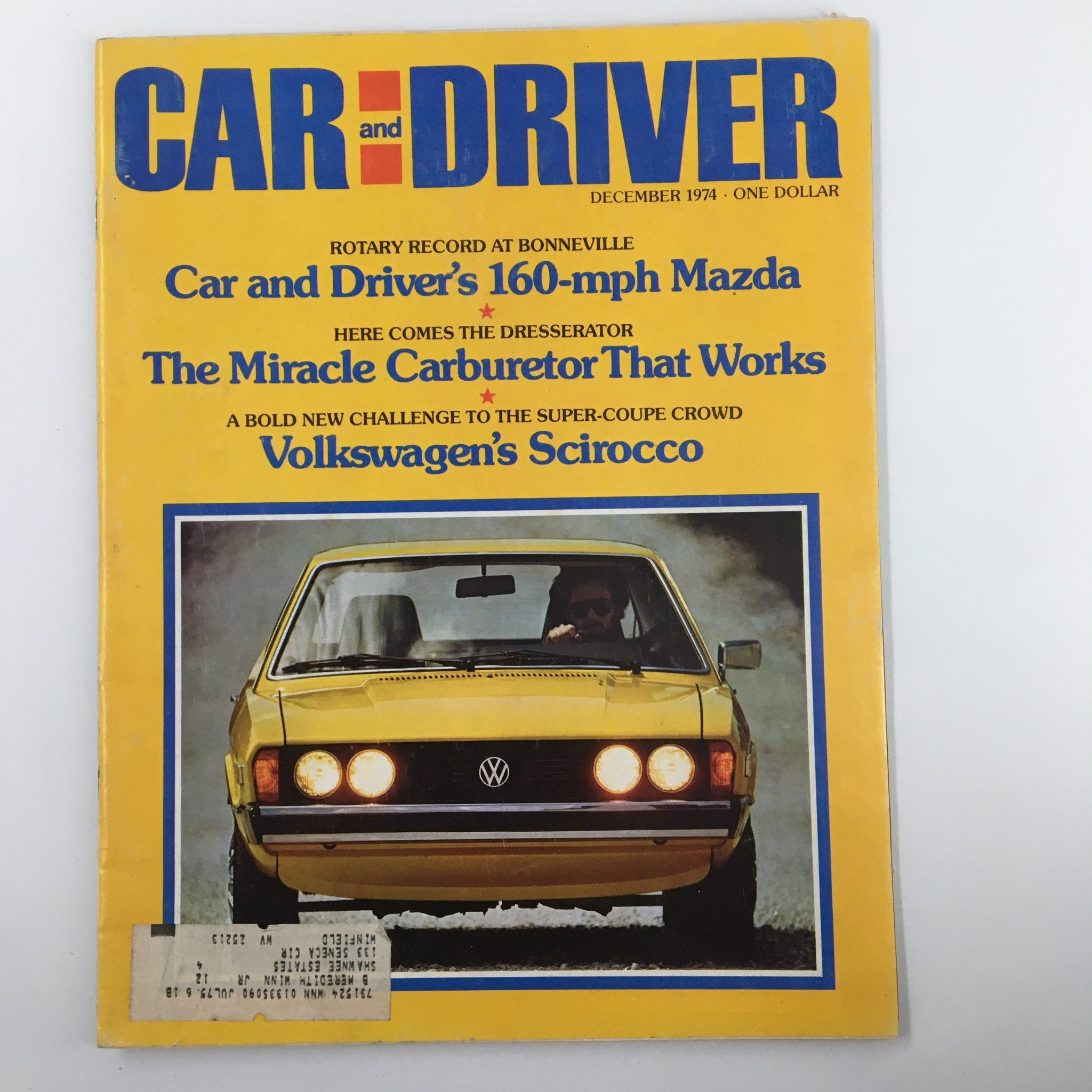 VTG Car and Driver Magazine December 1974 cover featuring The Miracle Carburetor That Works article, showcasing a vintage Volkswagen car and vibrant yellow design.