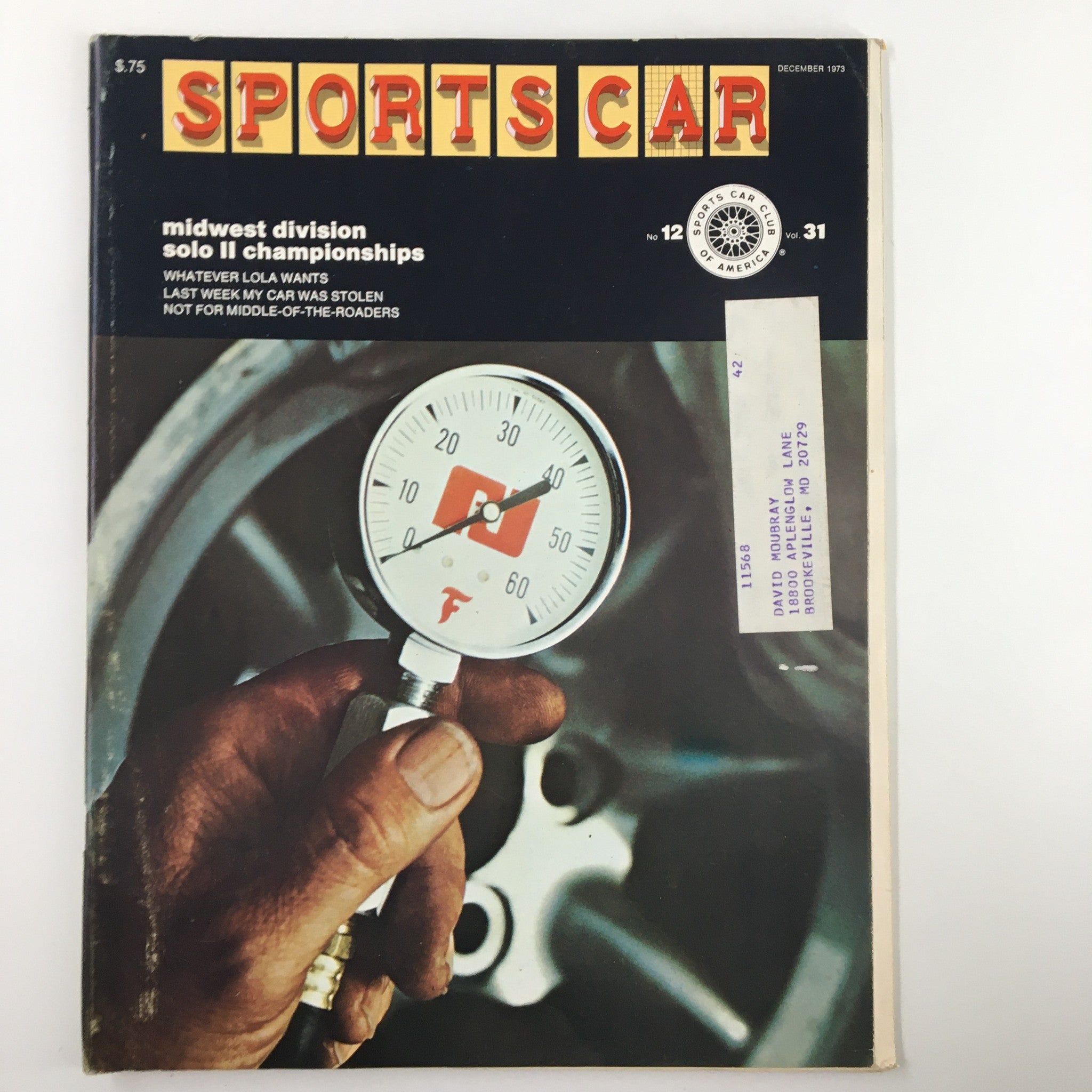 Cover of Sports Car Magazine December 1973, featuring the Midwest Division Solo II Championships, showcasing a hand holding a gauge on the magazine cover.