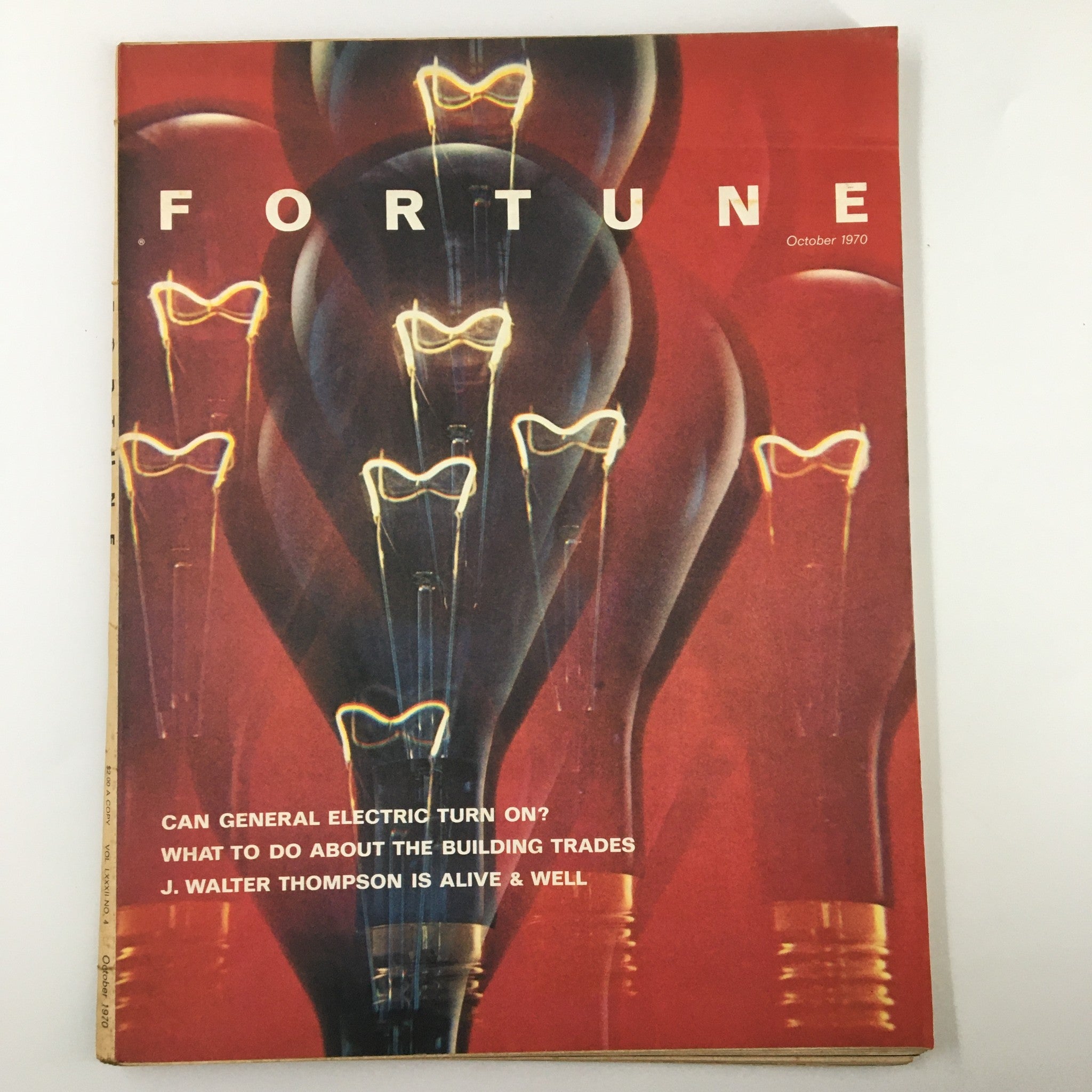 VTG Fortune Magazine October 1970 cover featuring J. Walter Thompson is Alive and Well. The cover showcases an artistic design with light bulbs and text highlighting topics like General Electric and building trades.