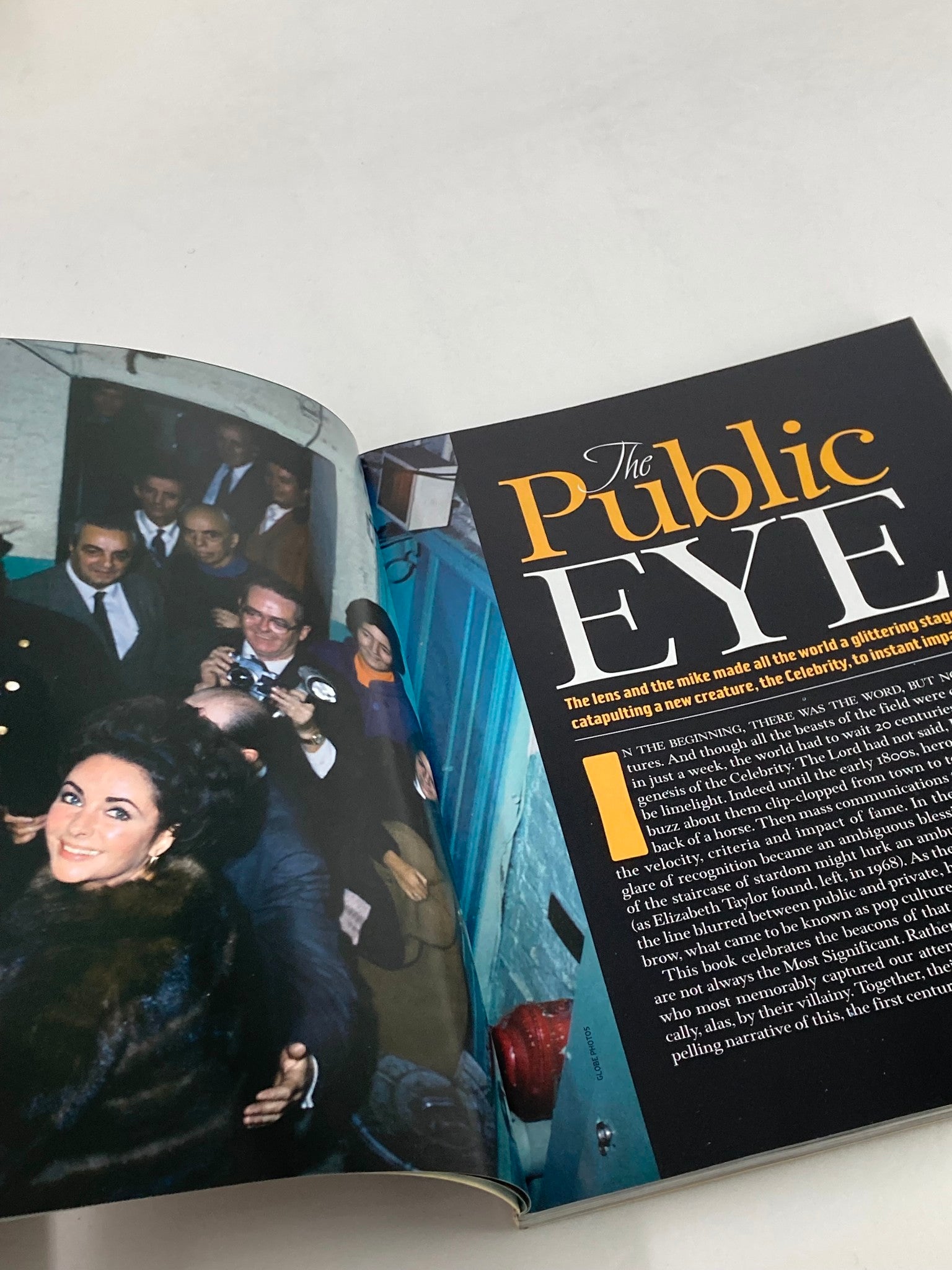 Inside pages of People Weekly Magazine 1998: The Most Intriguing People of the Century, highlighting an article titled 'The Public Eye' with a photograph of Elizabeth Taylor and other figures.