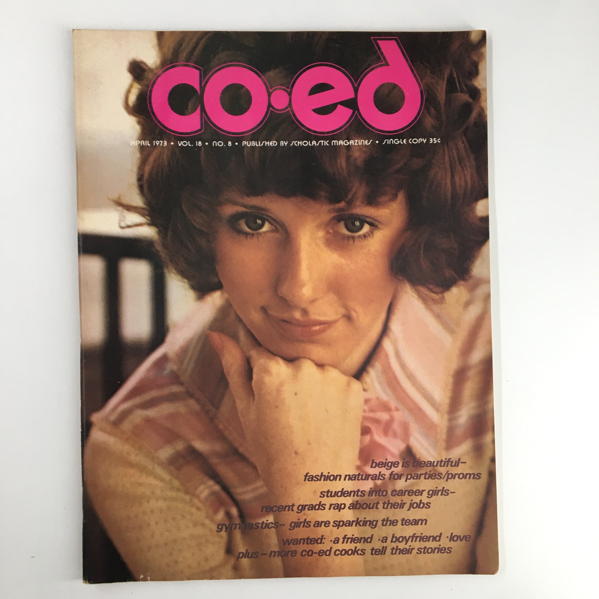 Cover of VTG Co-Ed Magazine April 1973 showcasing vintage fashion naturals for parties and proms, featuring a stylish model with curly hair.
