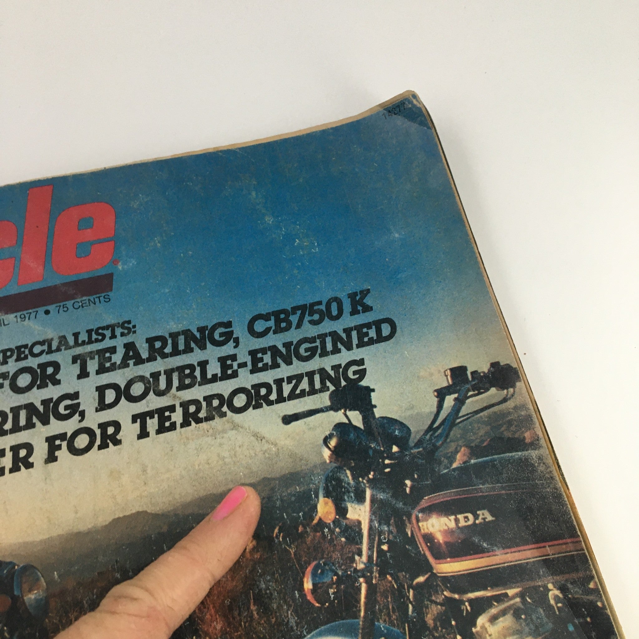 Close-up of Cycle Magazine April 1977 cover highlighting Honda CB750 F2 and CB750 K with an overview of featured articles. Image focuses on magazine title and key motorcycle information.