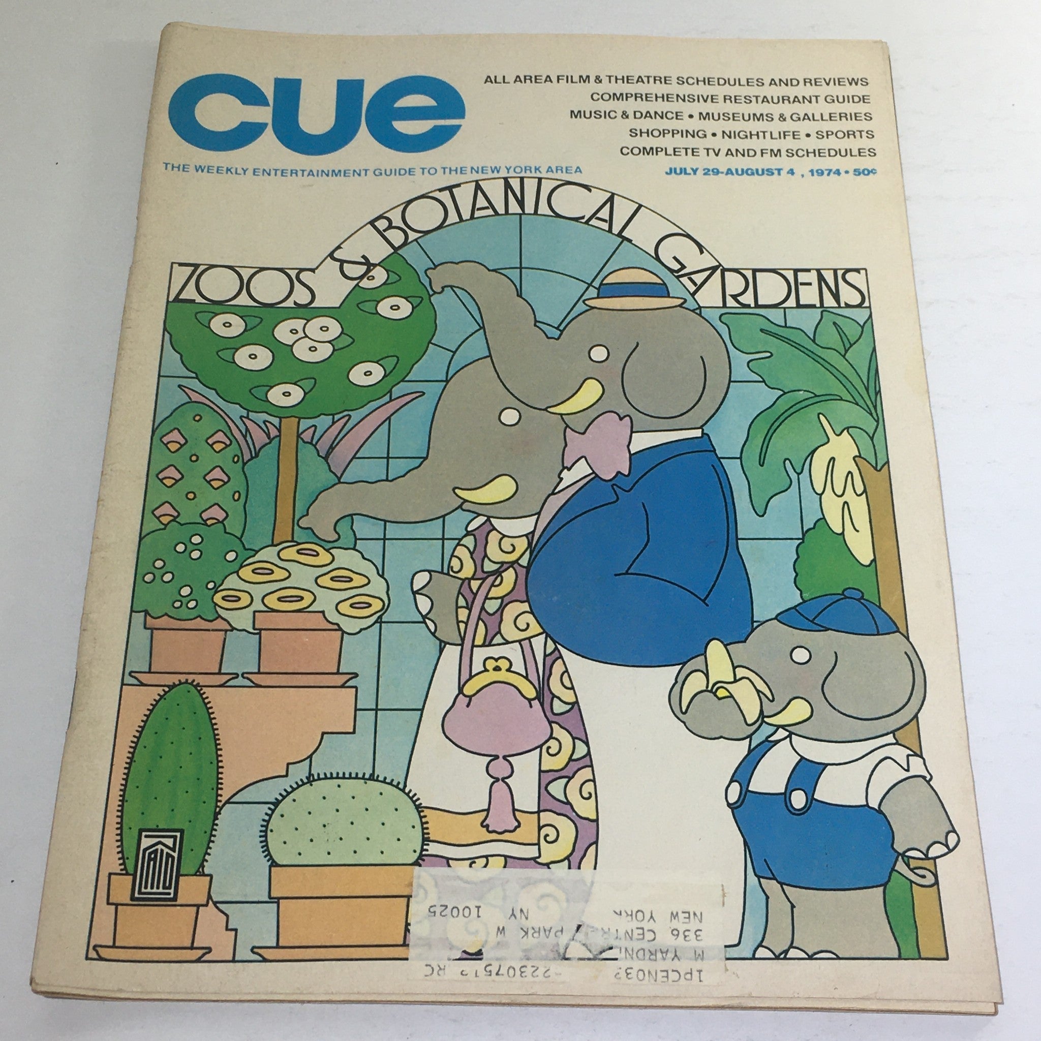 Cover of Cue Magazine: July 29-August 4, 1974, featuring a colorful illustration of elephants among botanical gardens and cacti, encapsulating the theme of zoos and botanical gardens.