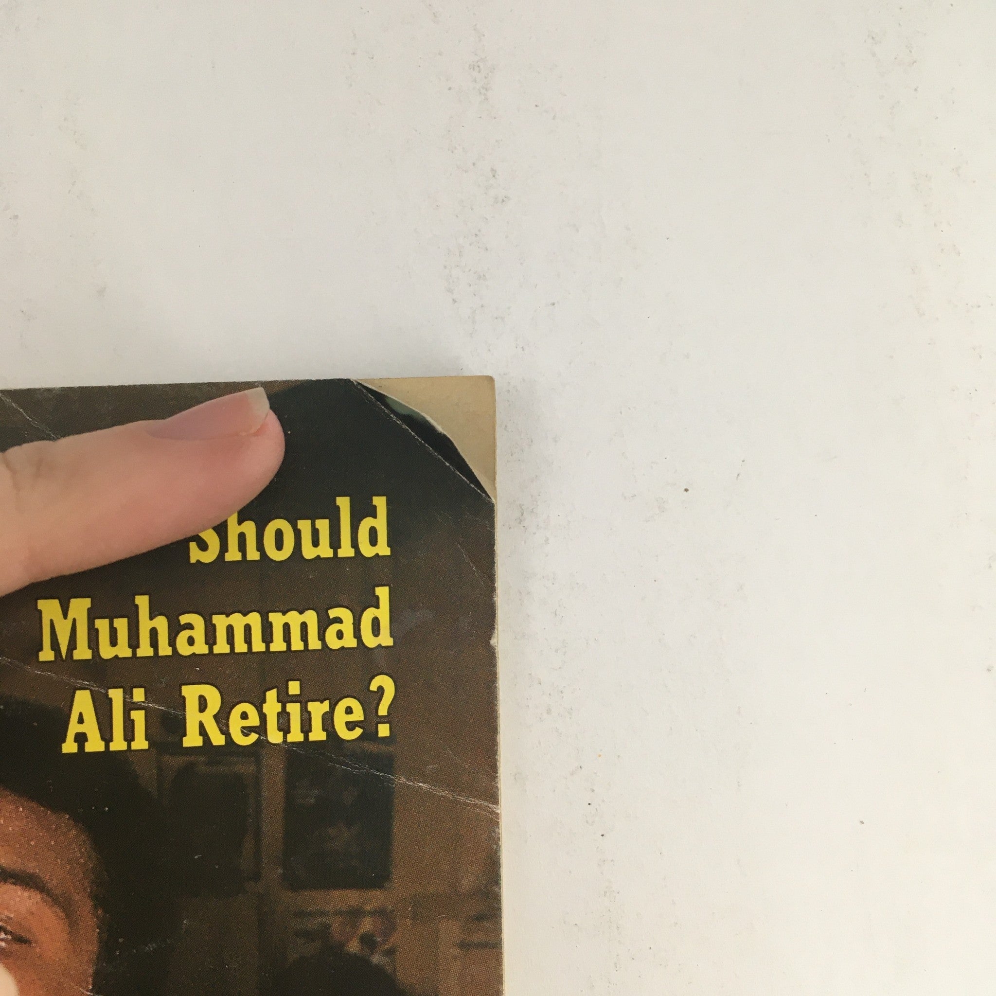 Close-up of Jet Magazine May 17, 1979, highlighting the headline 'Should Muhammad Ali Retire?'. The image shows a corner of the magazine cover, emphasizing the significance of the era in sports journalism.