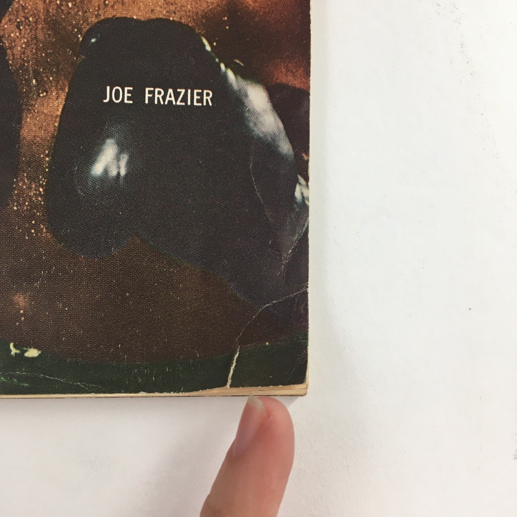 Close-up detail of the Jet Magazine cover from February 18, 1971, highlighting Joe Frazier's name and boxing gloves, emphasizing the iconic imagery associated with the magazine.