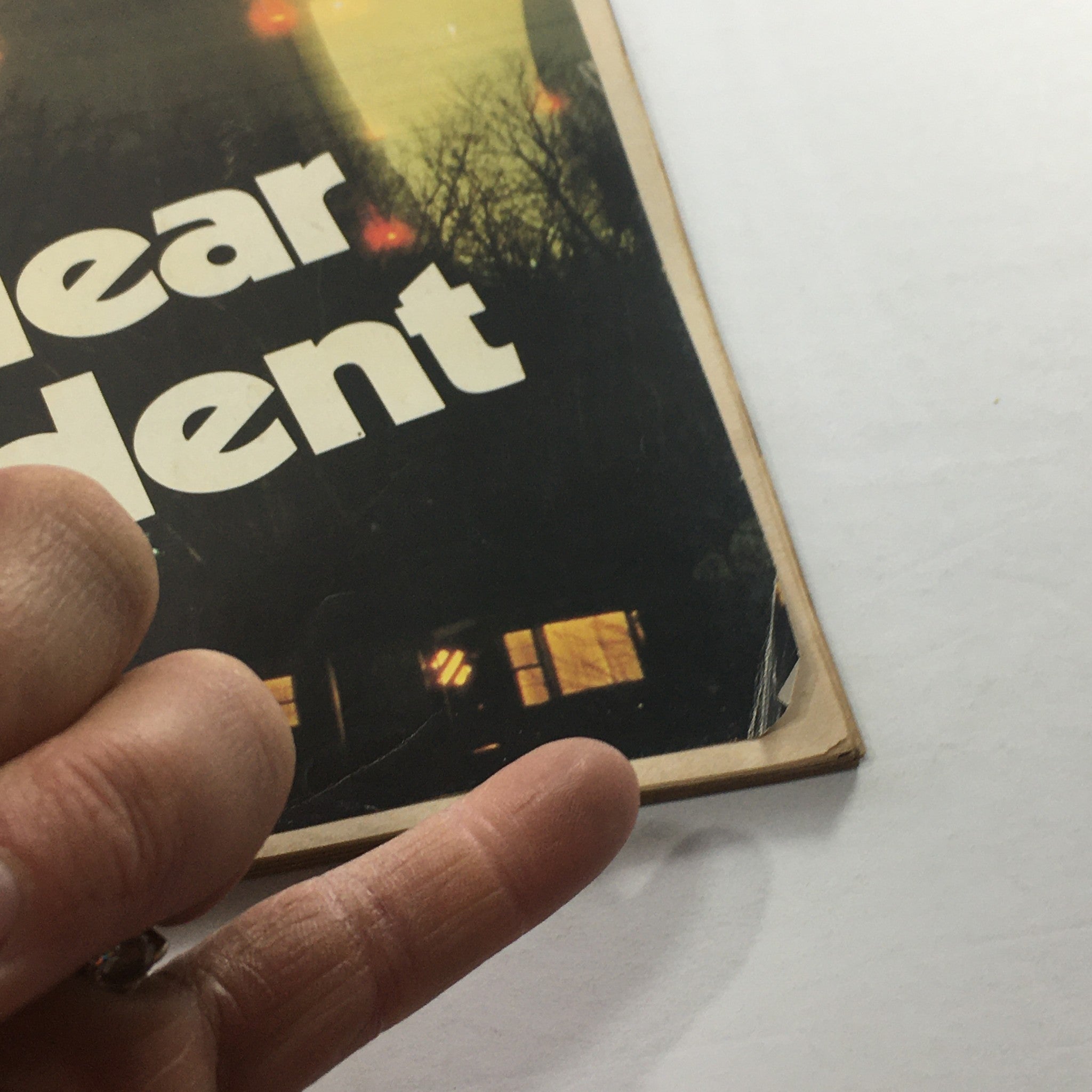 Close-up of the Newsweek Magazine cover dated April 9, 1979, showcasing the title 'Nuclear Accident' with a pointed finger indicating vintage age and wear.