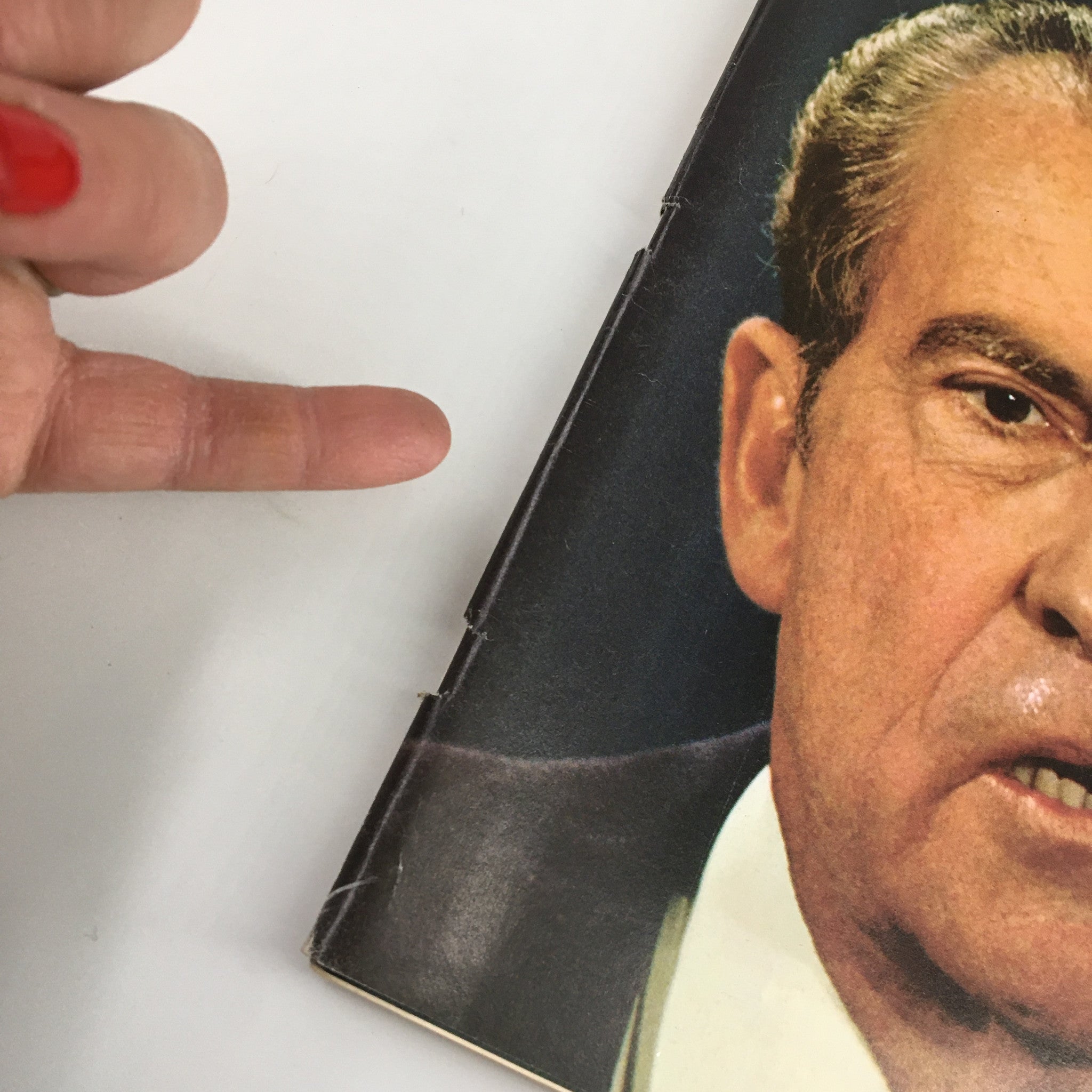 Close-up view of the spine of VTG Newsweek Magazine March 18 1974 with Richard Nixon on the cover, highlighting the magazine's condition and vintage appeal.