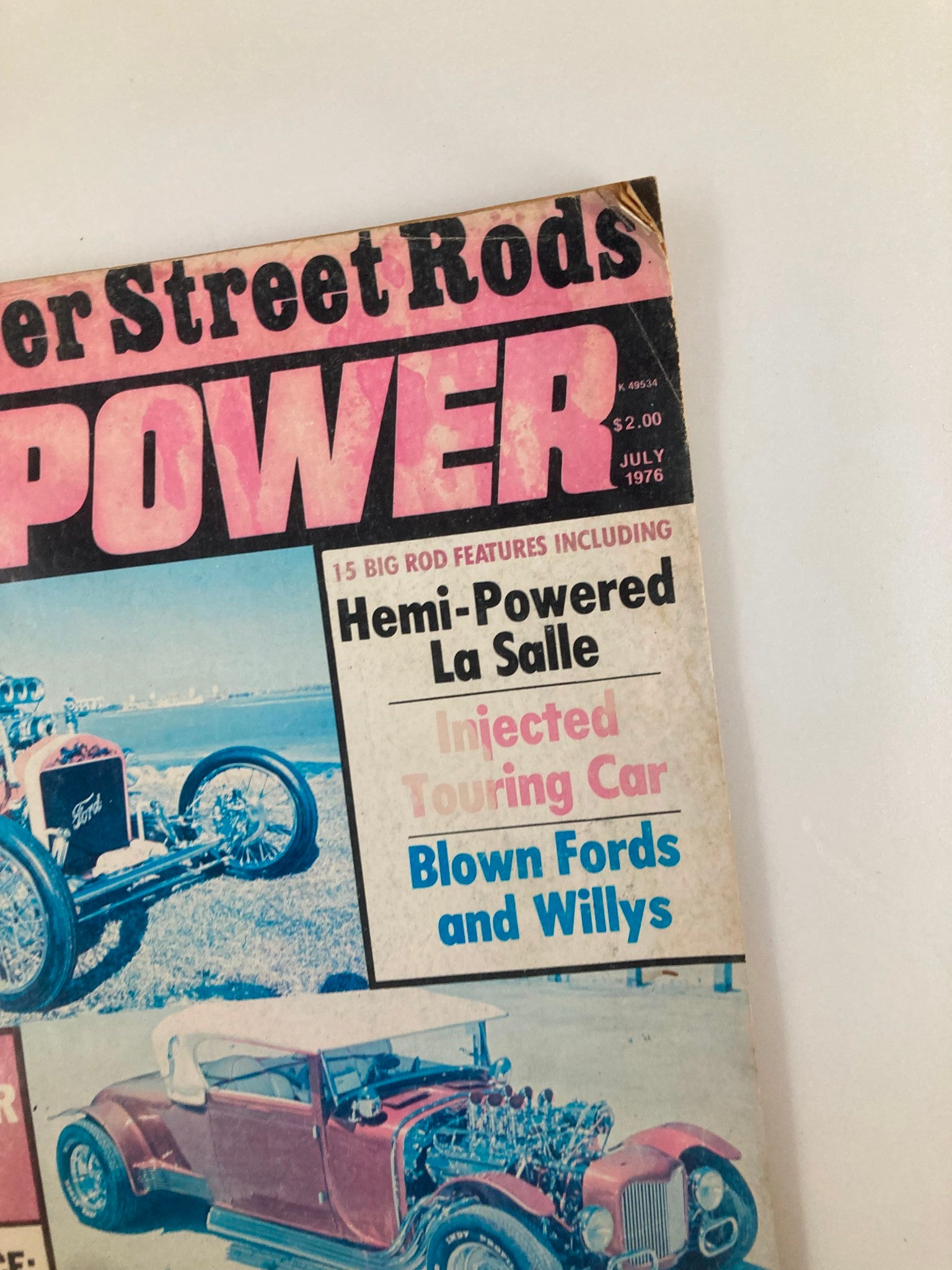 Close-up of VTG Rod Power Magazine June 1976 Vol 1 #1 showcasing the featured Hemi-Powered La Salle and other classic cars.