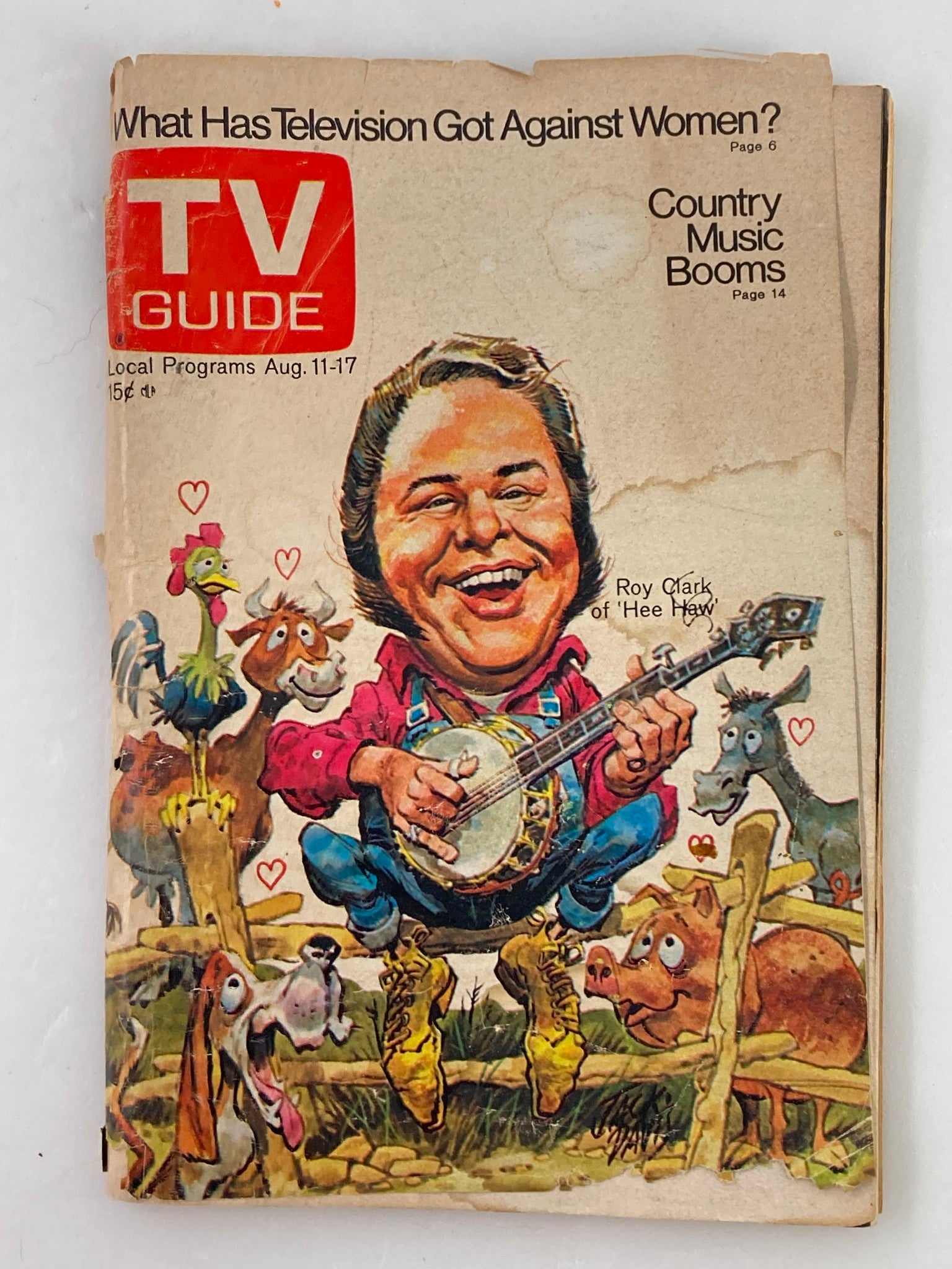 Cover of TV Guide Magazine August 11 1973 #563 featuring a colorful illustration of Roy Clark surrounded by animals, showcasing a playful cartoon style, with the title 'What Has Television Got Against Women?' and references to country music.