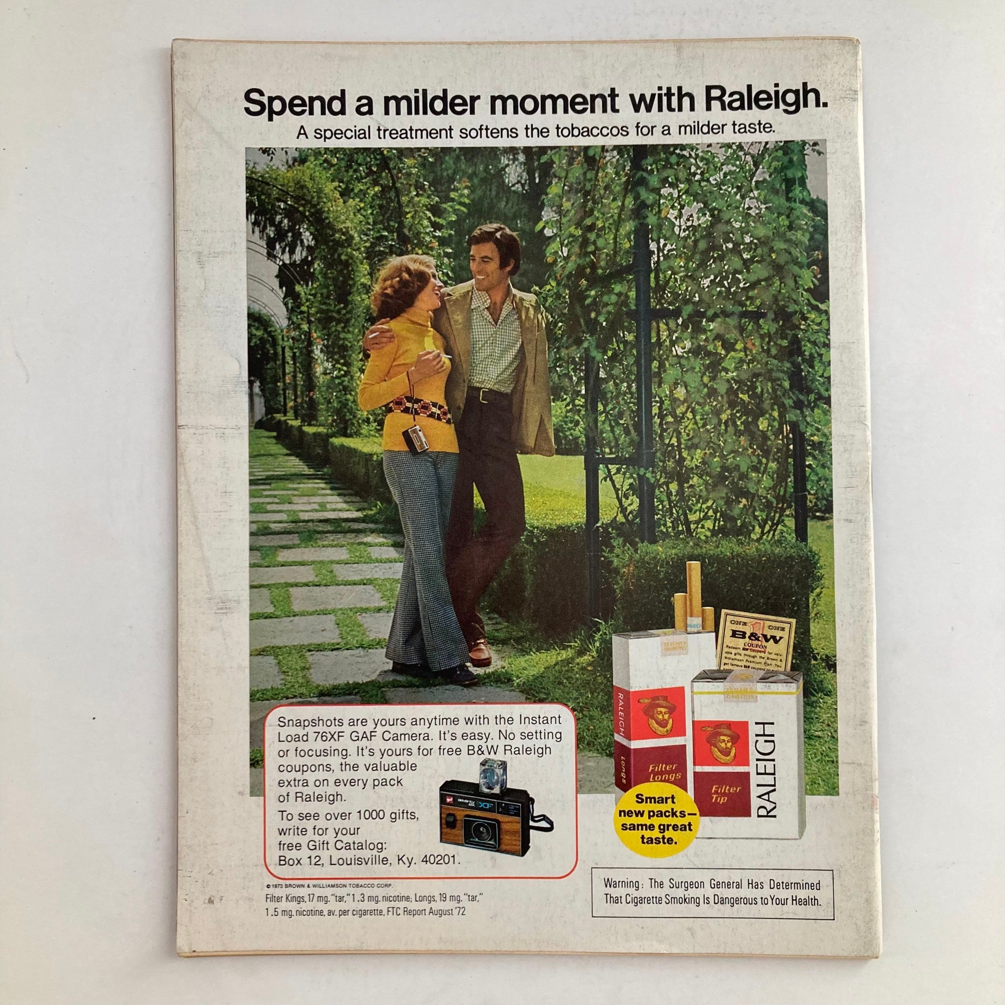 Advertisement page from the February 26, 1973 Newsweek magazine showcasing a couple enjoying a moment together, promoting Raleigh cigarettes. Title includes 'VTG Newsweek Magazine February 26 1973 Lt. Cmdr. Paul Galanti and Wife'.