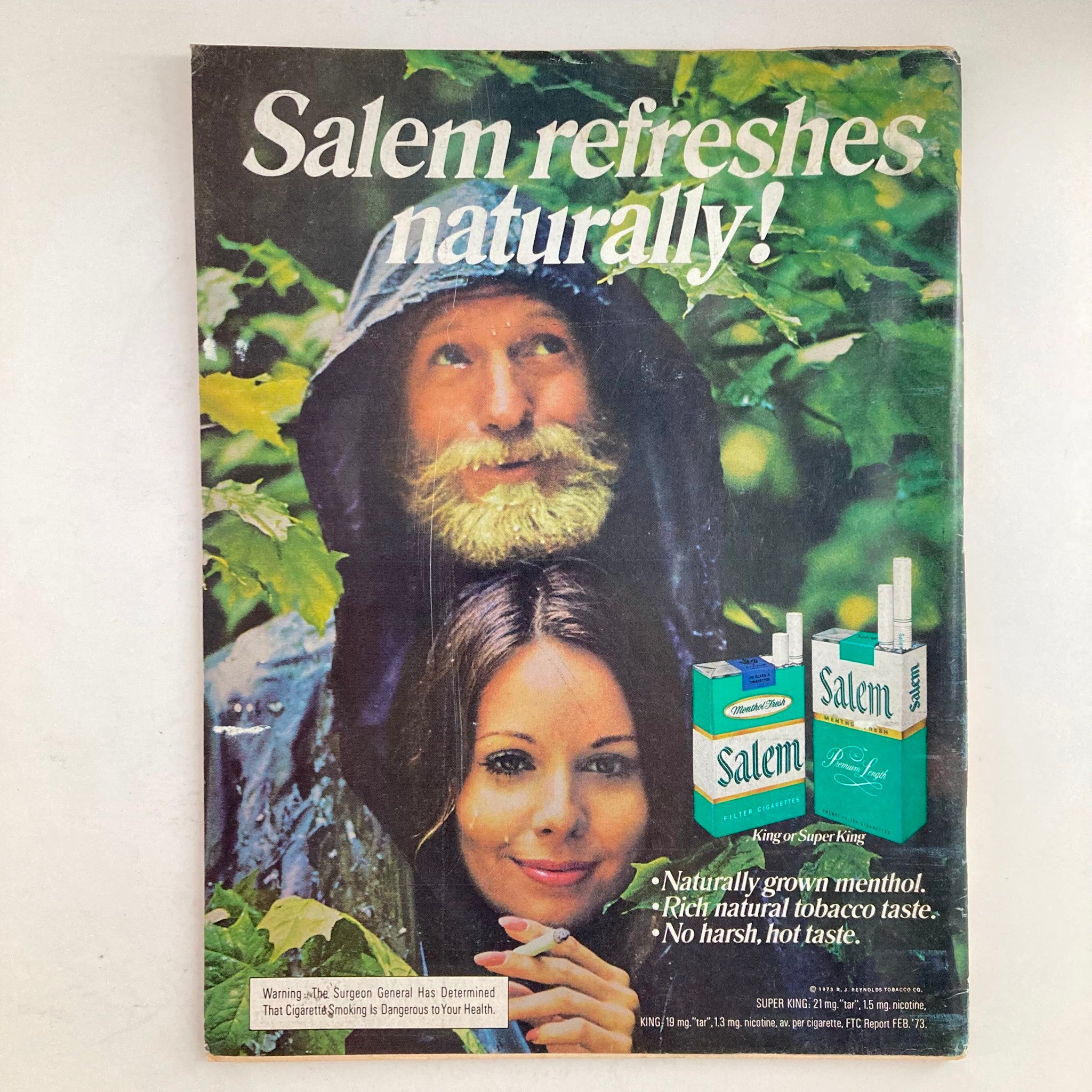Cover of vintage advertisement for Salem cigarettes, with the tagline 'Salem refreshes naturally!' featuring a bearded man and a smiling woman.