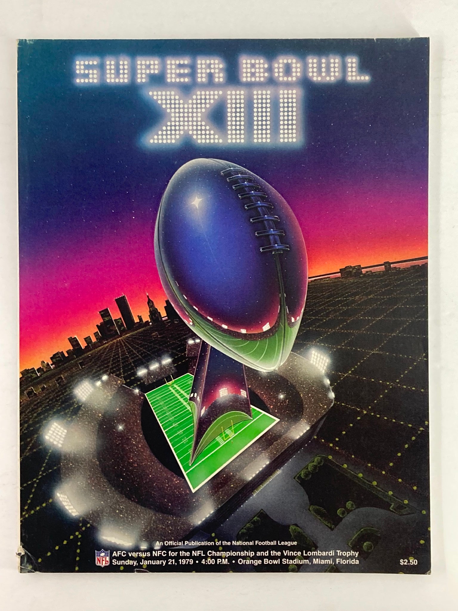 Cover of the 1979 NFL Super Bowl XIII Magazine featuring a vibrant design with a football and the Vince Lombardi Trophy, representing the AFC vs NFC championship.