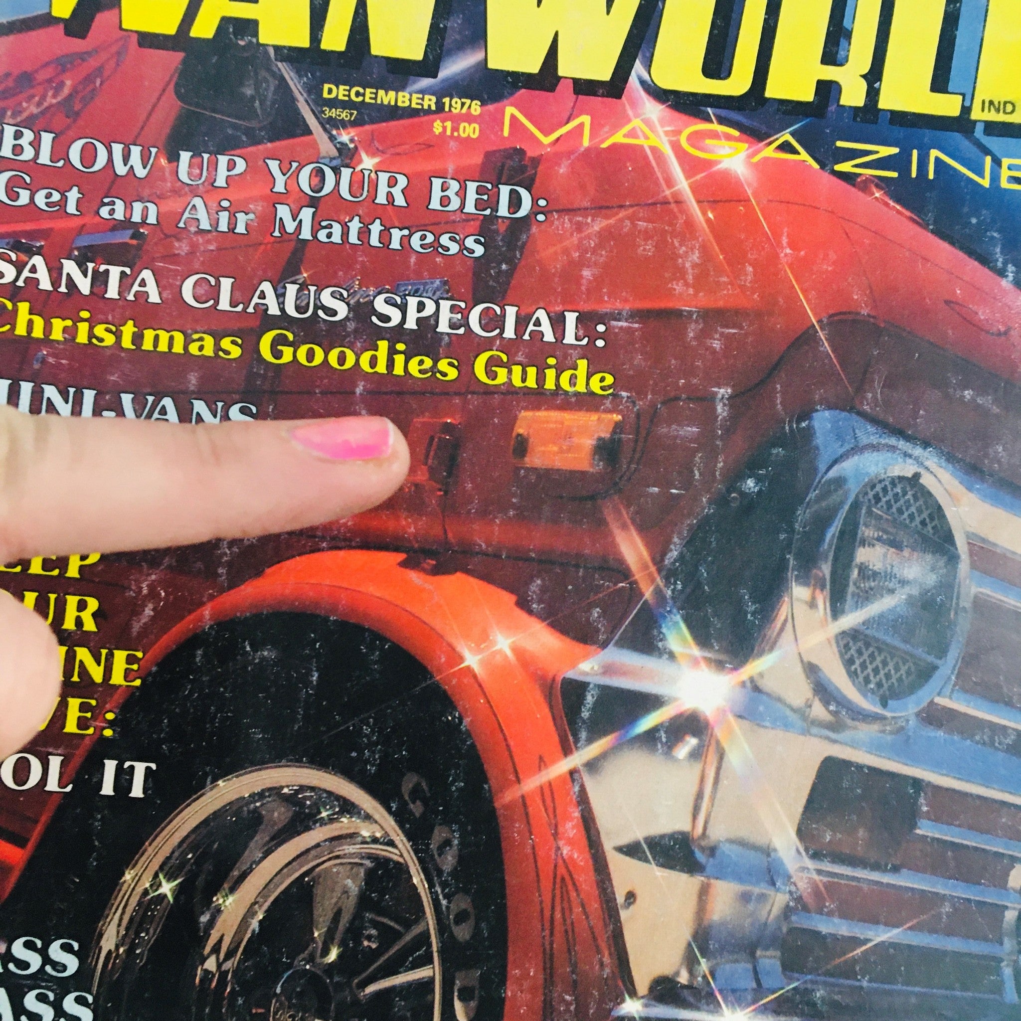 Close-up of Van World Magazine December 1976 cover highlighting articles including 'Christmas Goodies Guide' and 'Blow Up Your Bed'.