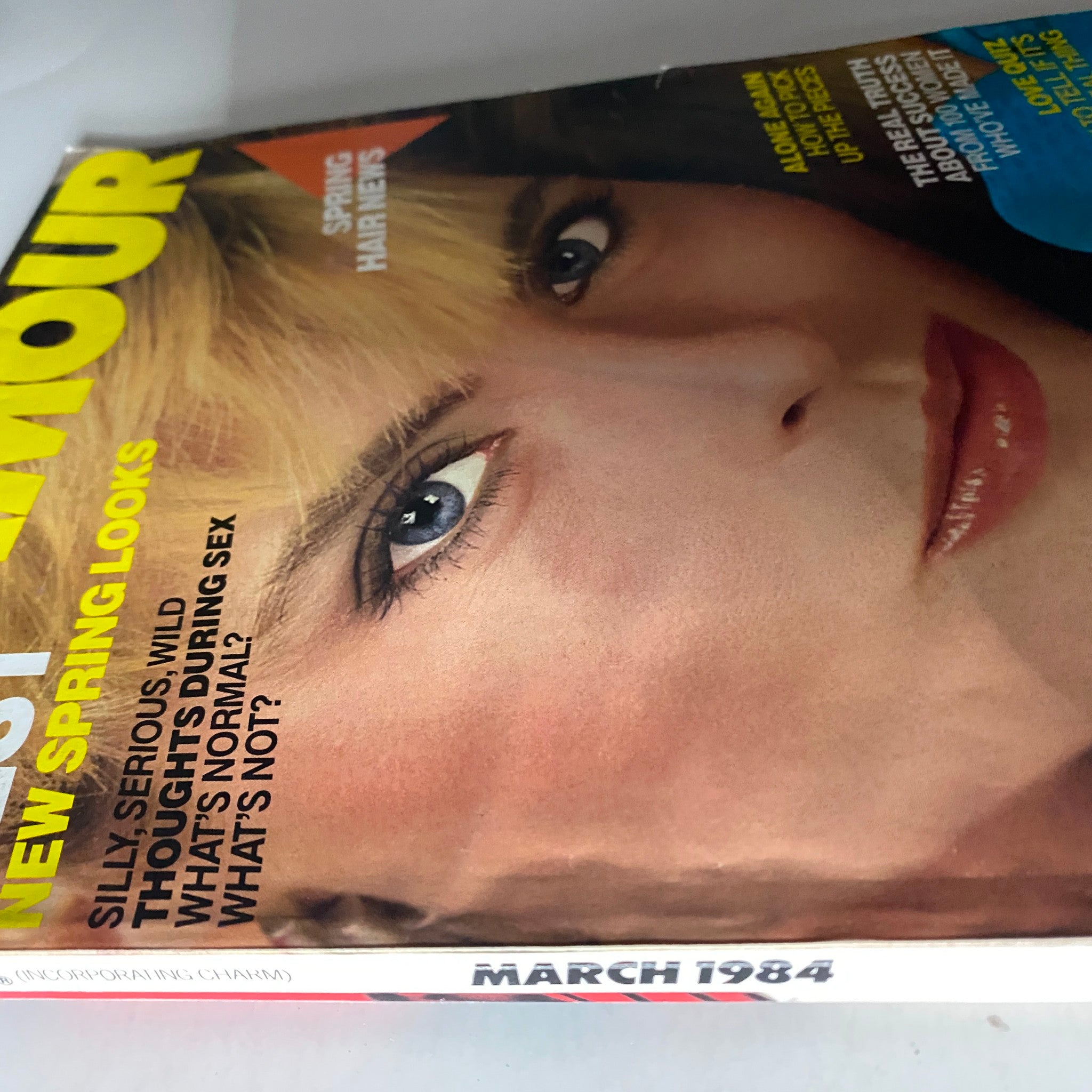 Close-up view of Glamour Magazine March 1984 Kim Alexis Cover highlighting 'Best New Spring Looks' and beauty tips.