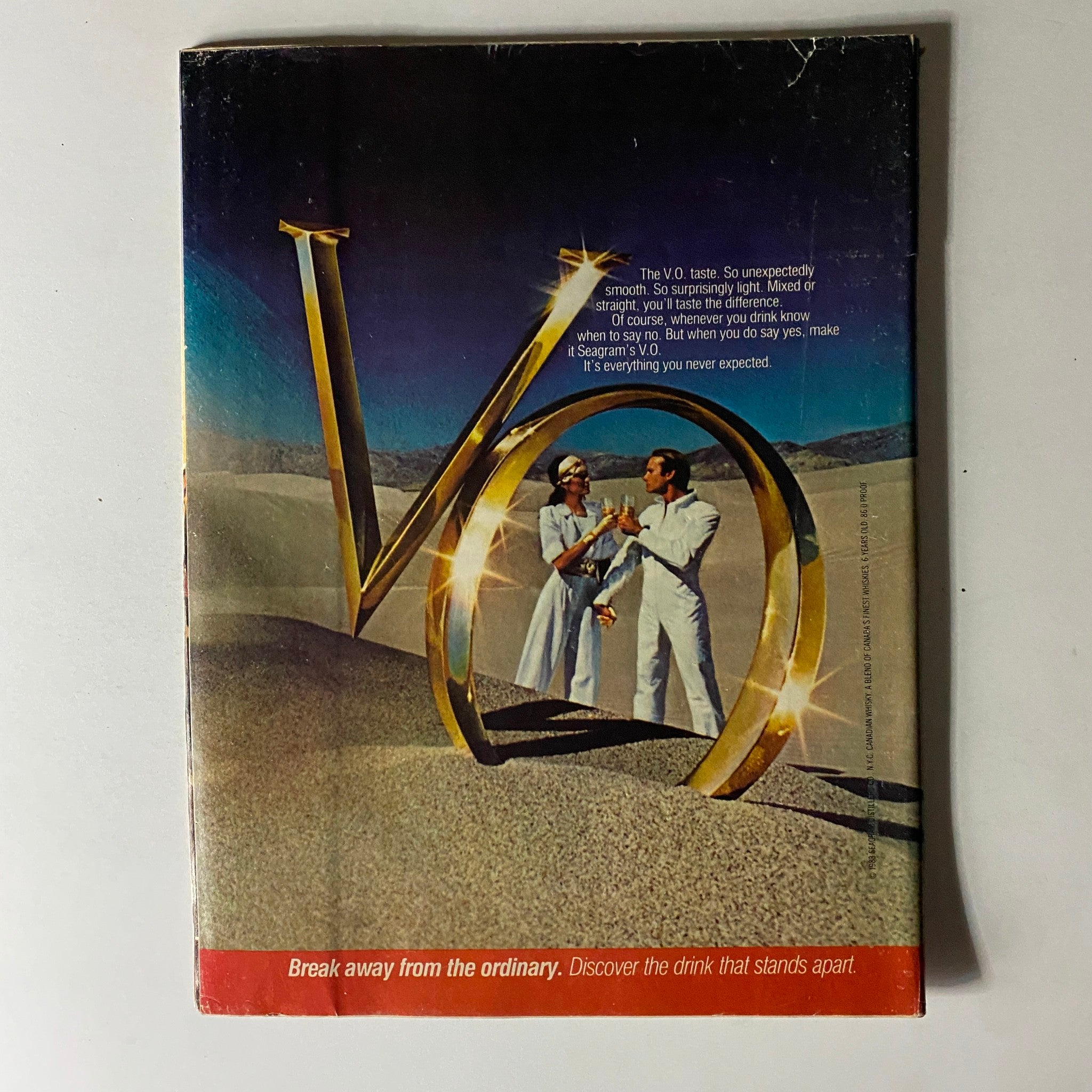 Back cover of People Weekly Magazine March 7, 1983, showcasing an advertisement for Seagram's V.O. whiskey with a couple celebrating in the sand.