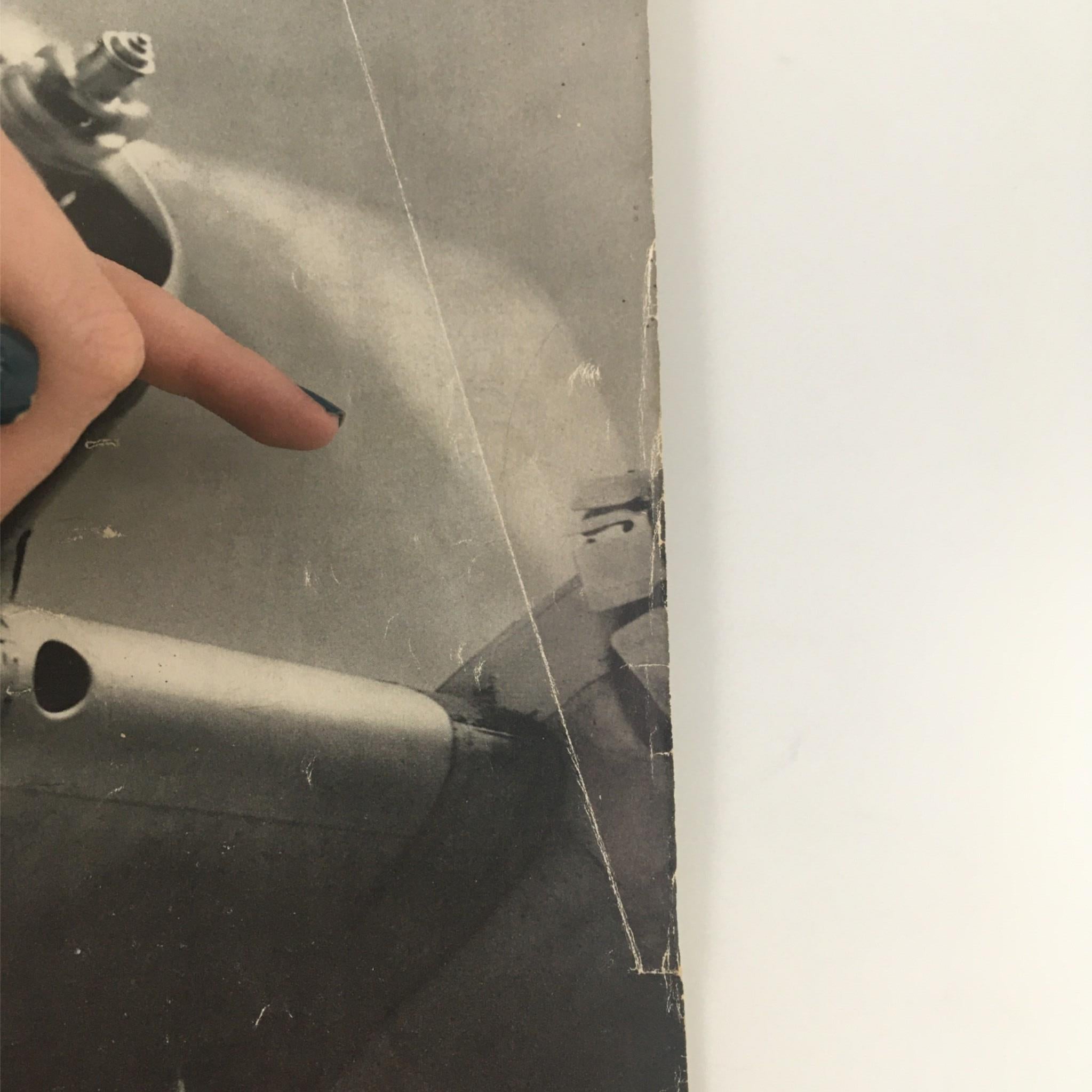 Close-up of a page from VTG Life Magazine August 23, 1937 highlighting the Transoceanic Transport Plane, with a finger pointing to a detail.