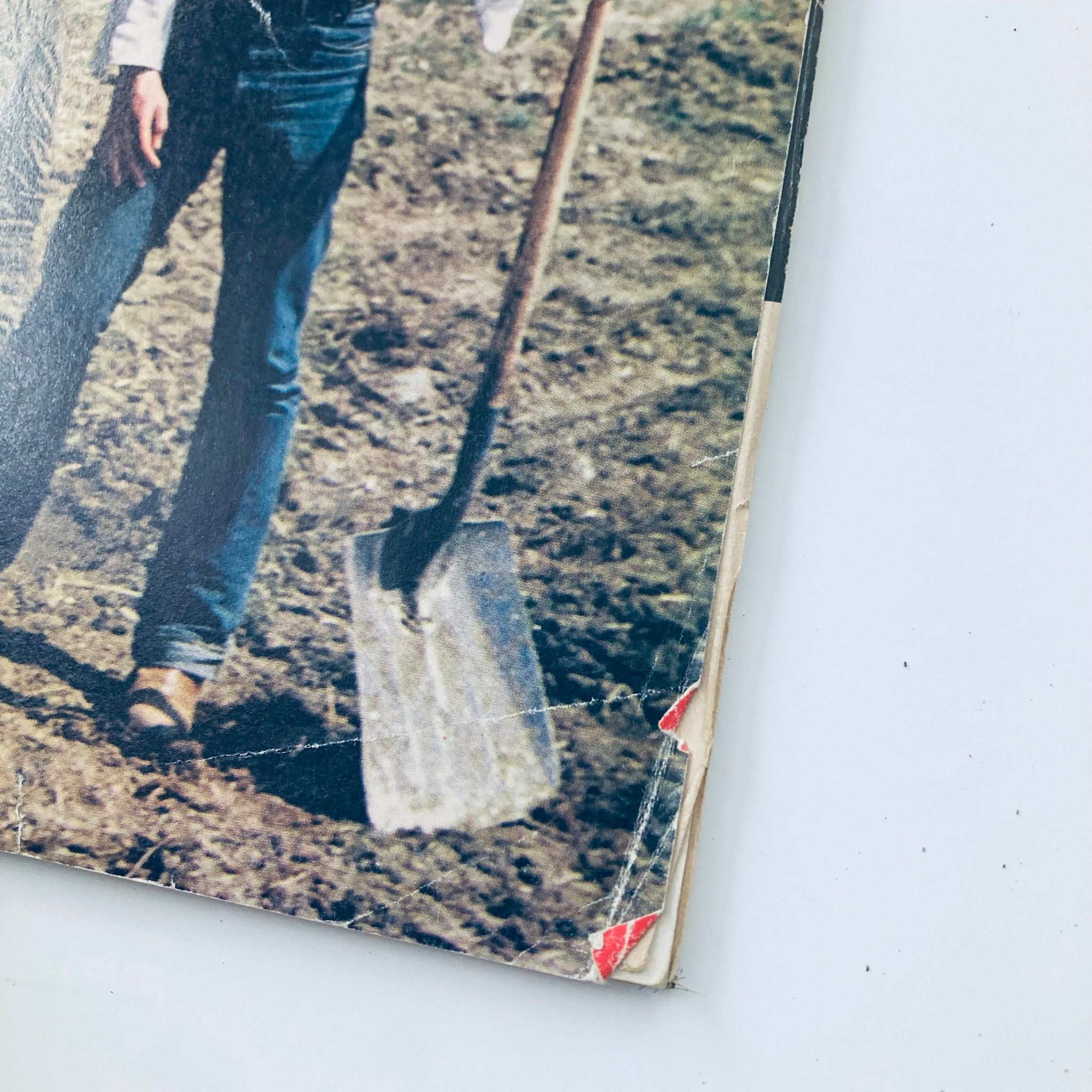 Cover of Vintage National Lampoon Magazine June 1977 Vol 1 #87 showcasing a person with a shovel in a field.