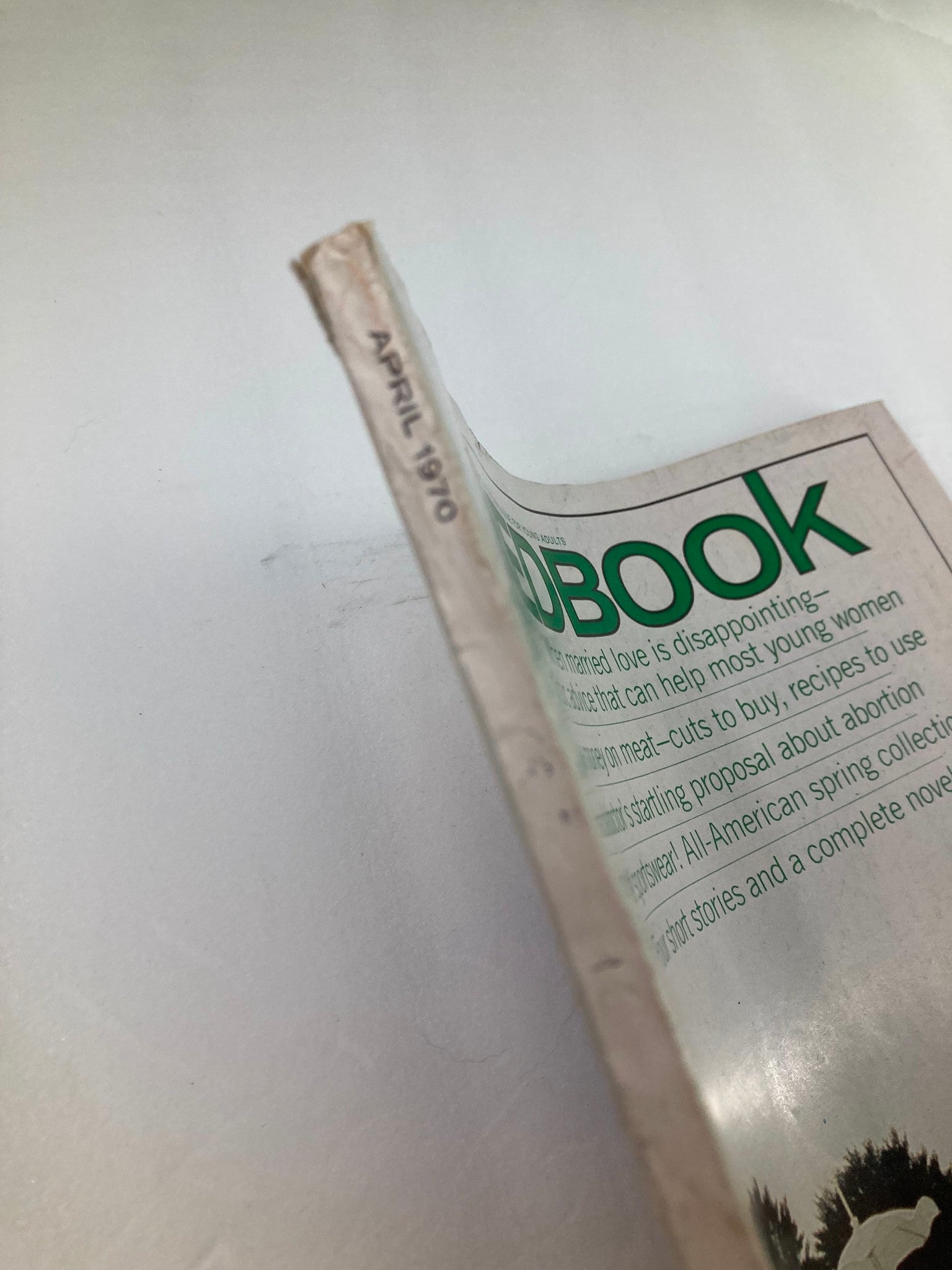 Side view of the VTG Redbook Magazine April 1970, showcasing the spine with 'APRIL 1970' printed on it, indicating the magazine's original publishing date.