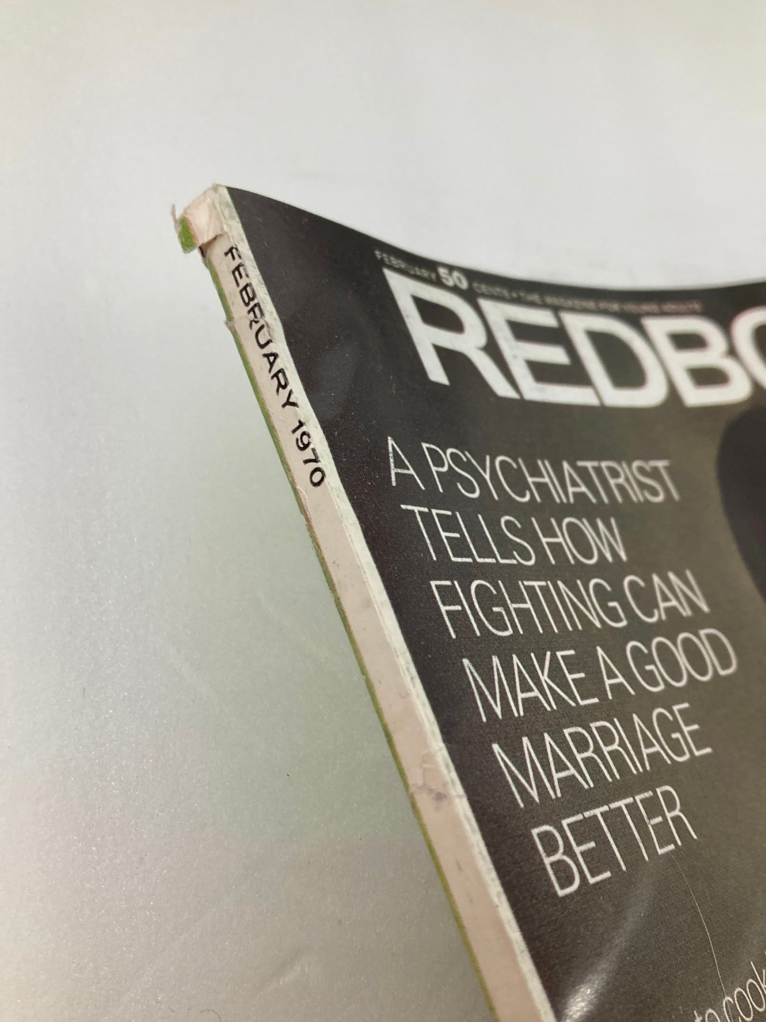 Close-up view of the spine of the Vintage Redbook magazine from February 1970, highlighting its title and publication month.