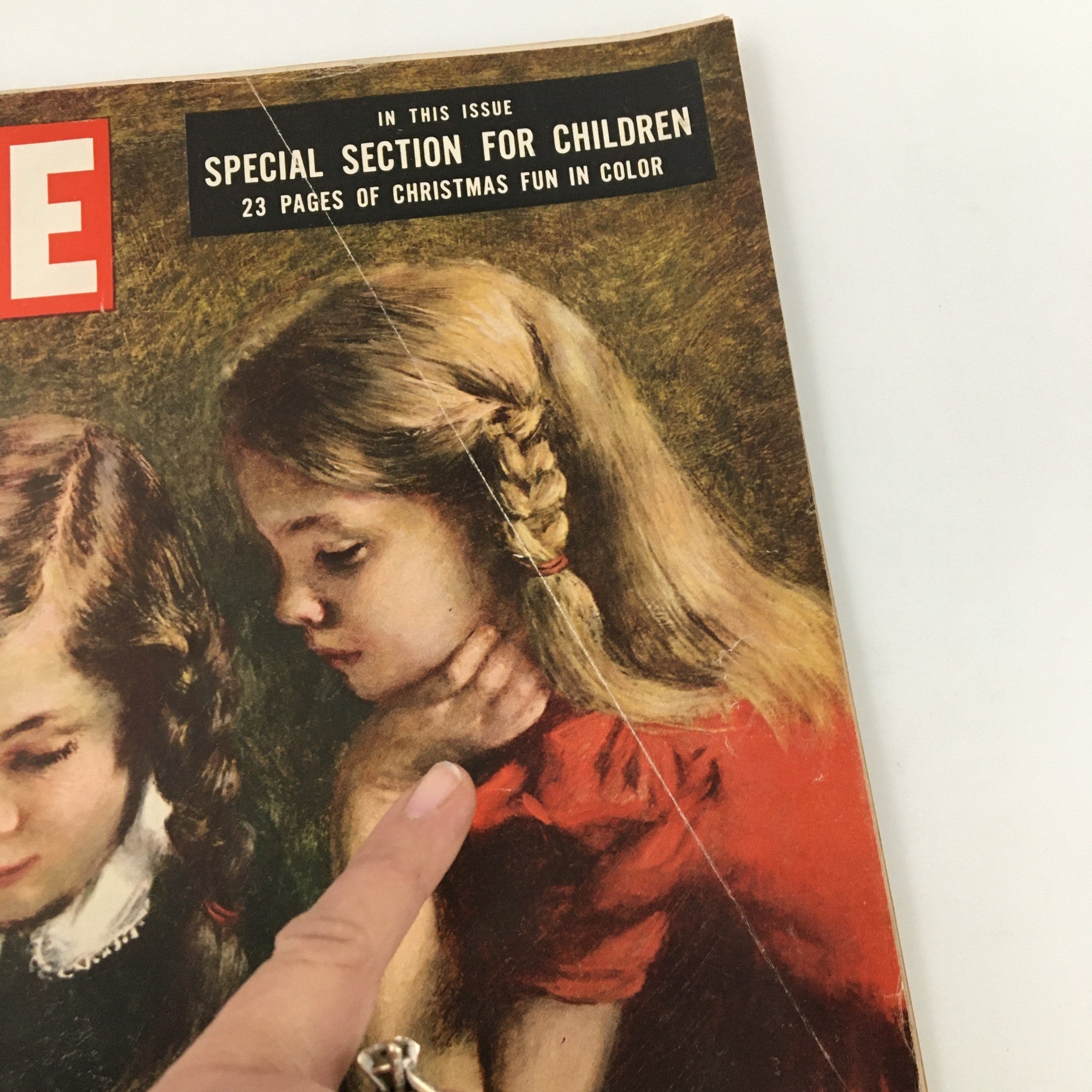 Close-up of the cover of VTG Life Magazine December 25 1950 Special Section for Children Issue. The image focuses on the text highlighting 'Special Section for Children' and displays an artistic depiction of two girls, emphasizing the magazine's appeal for young readers.