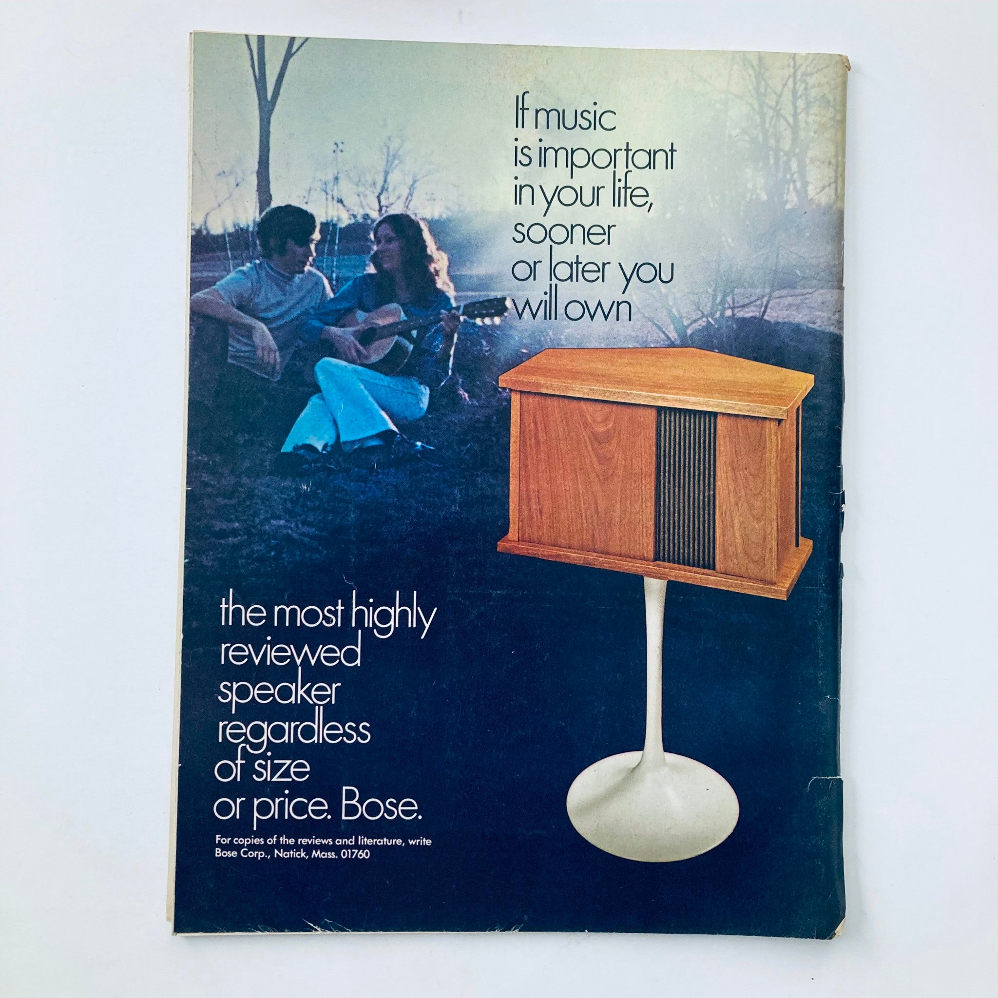 Back cover of the Vintage National Lampoon Magazine April 1972 Collegiate Songbook featuring an advertisement for Bose speakers with a couple playing guitar.