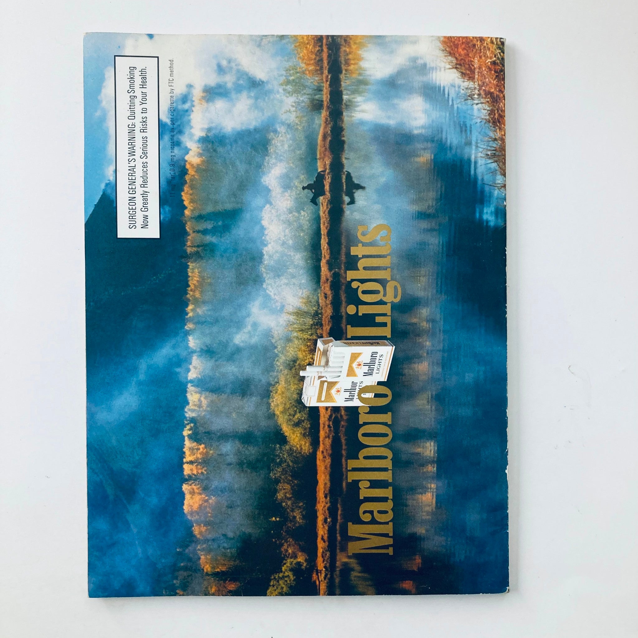 Back cover of Playboy Magazine April 1993, presenting artistic scenery with Marlboro Lights branding, part of a unique collectible experience.