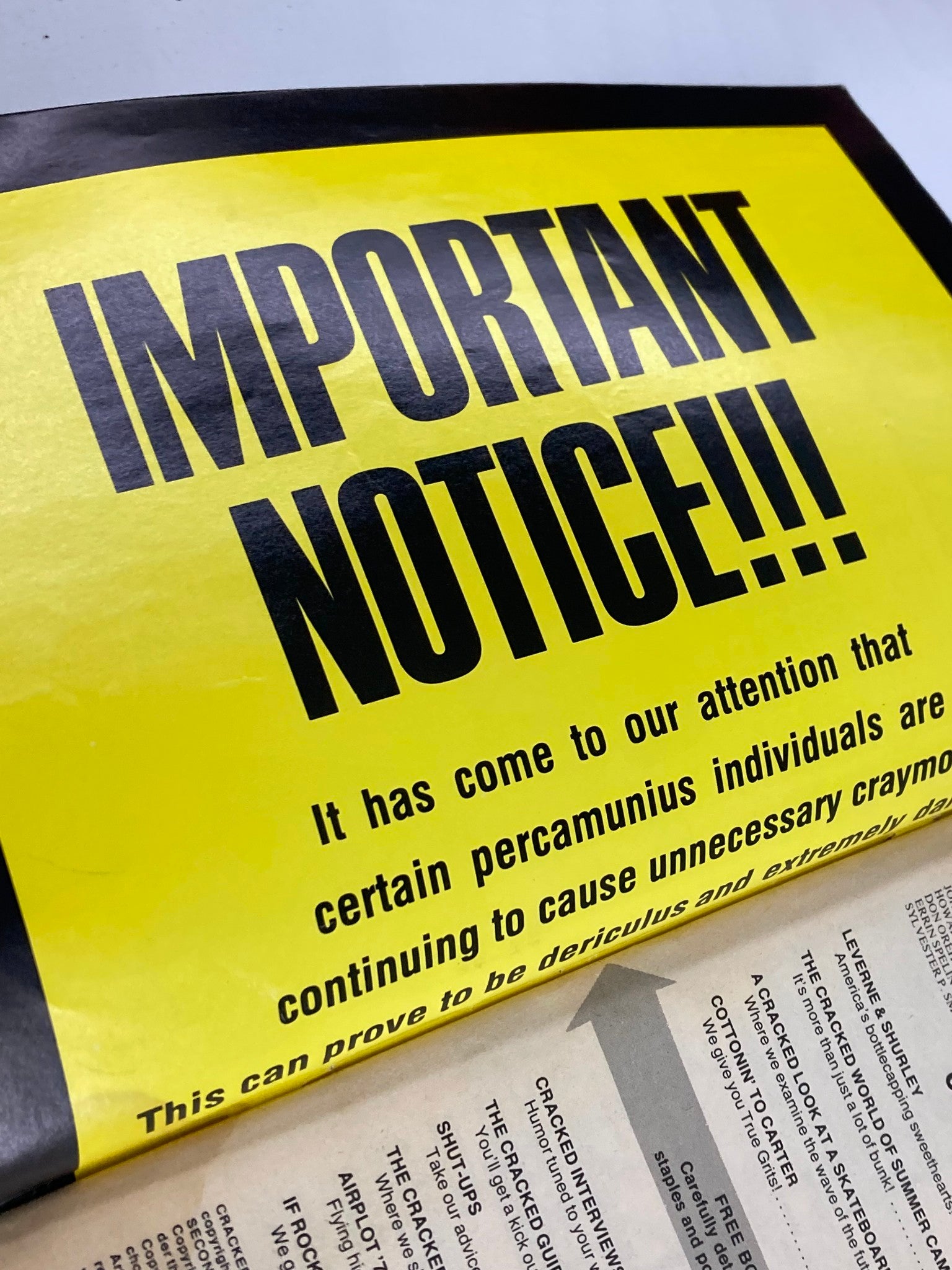 Important notice section from the VTG Cracked Humor Magazine October 1977 highlighting amusing disclaimers with a bright yellow background.